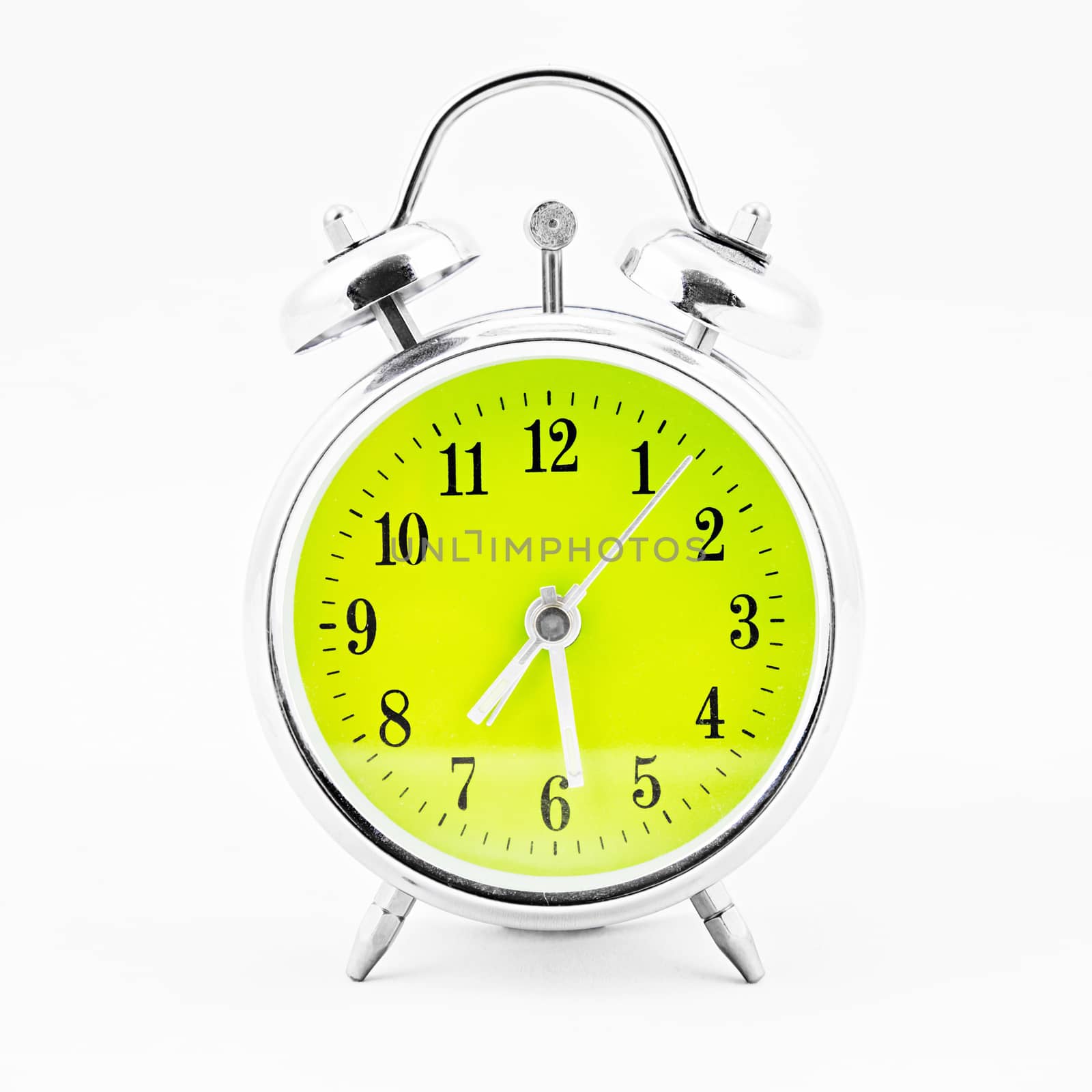 Alarm clock on white background. Showing time twenty eight minutes past seven