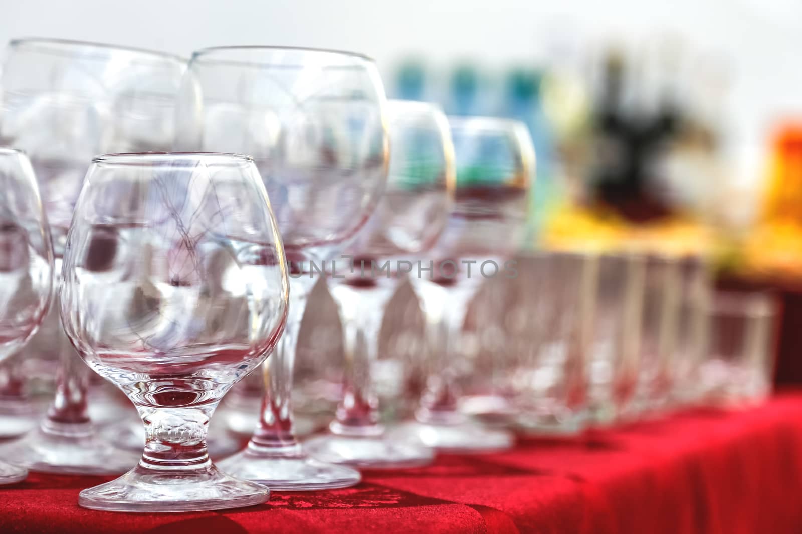 Empty wine glasses composition on table before celebration at outdoor