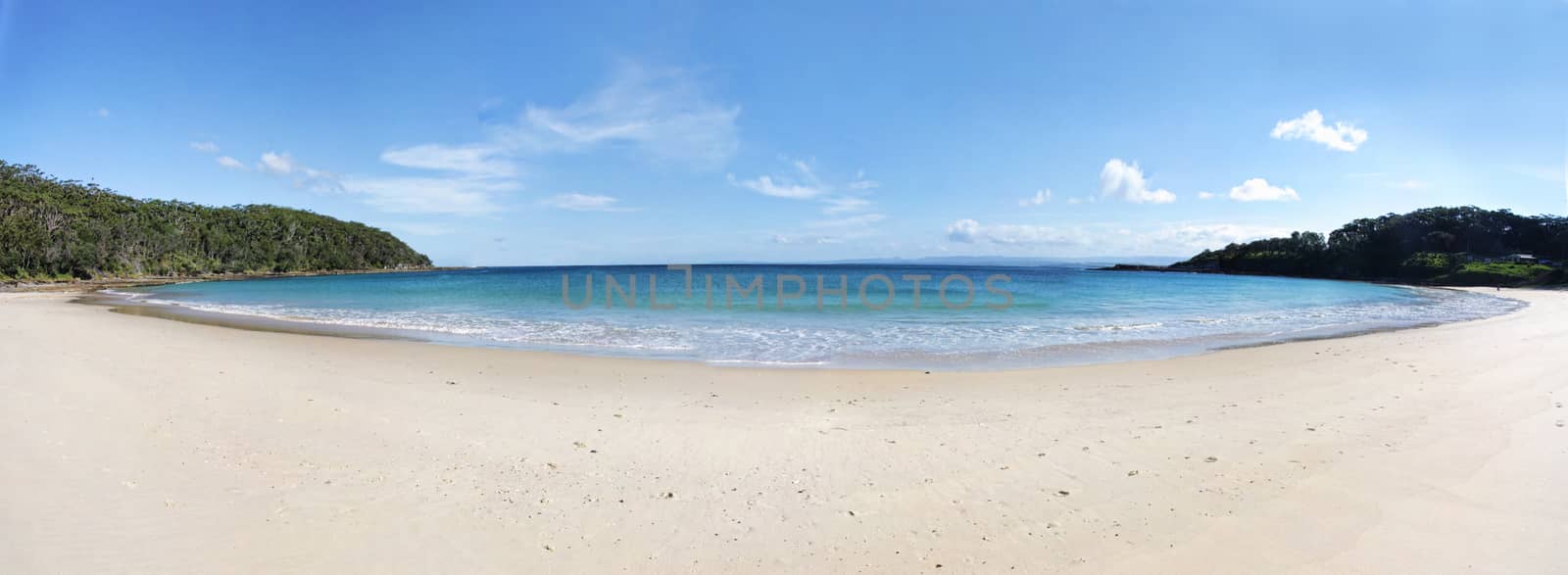Summercloud Bay panorama on a beautiful sunny day. It is a semicircular, 500 m wide southwest facing bay   When conditions are right, it is a popular surf beach with breaks of 4m at the left side and is also known as Aussie Pipe or Pipeline. Australia