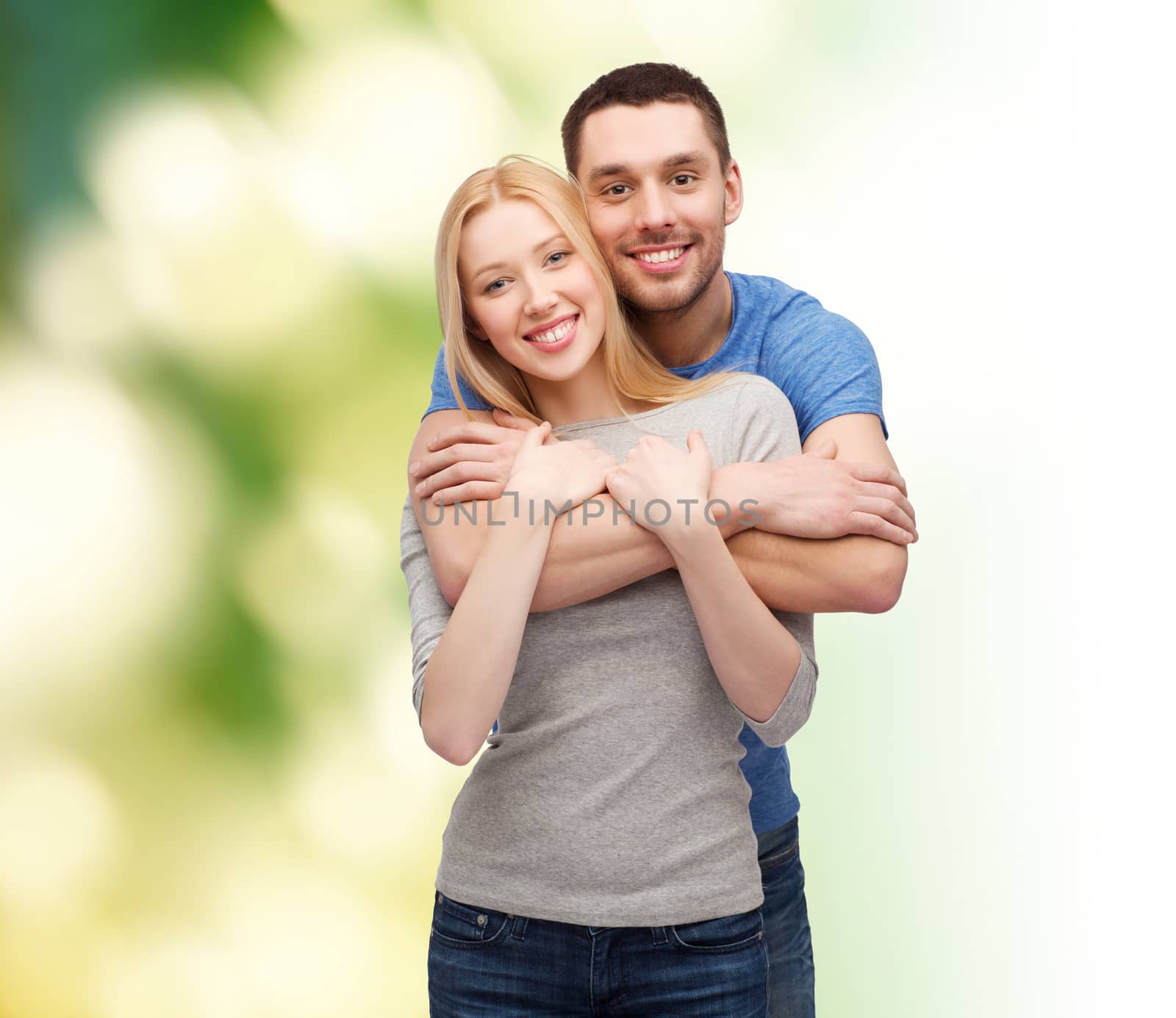 love and family concept - smiling couple hugging