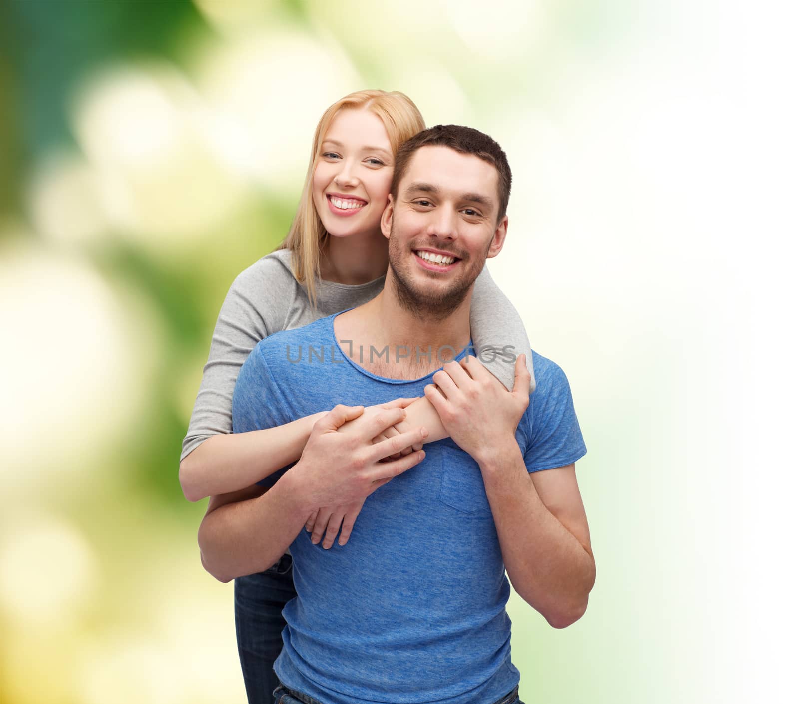 love and family concept - smiling couple hugging