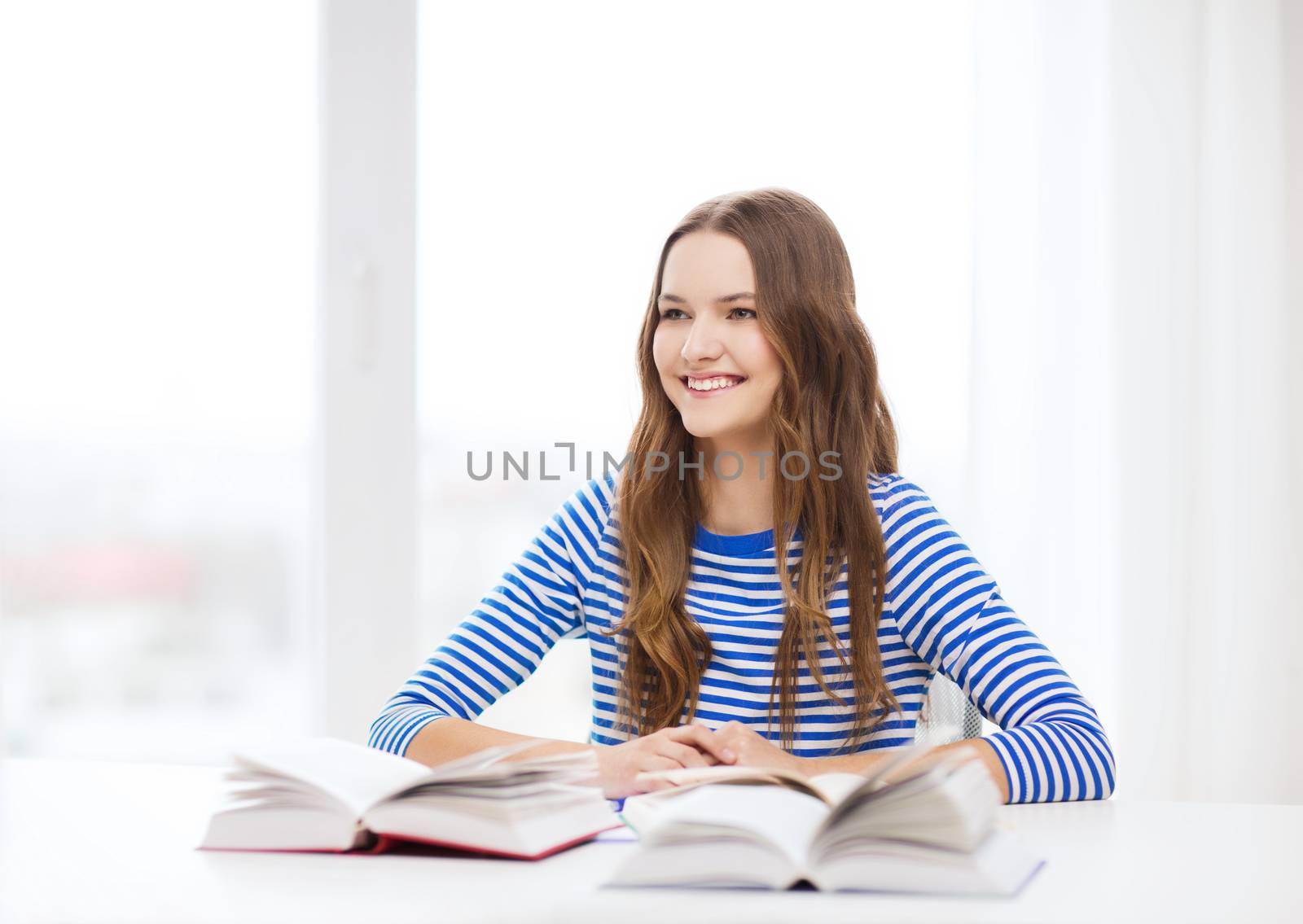 education and home concept - happy smiling student girl with books