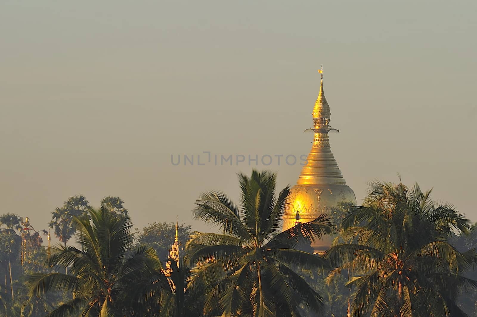 Shwezigon Pagoda in Rangoon, Myanmar. by think4photop