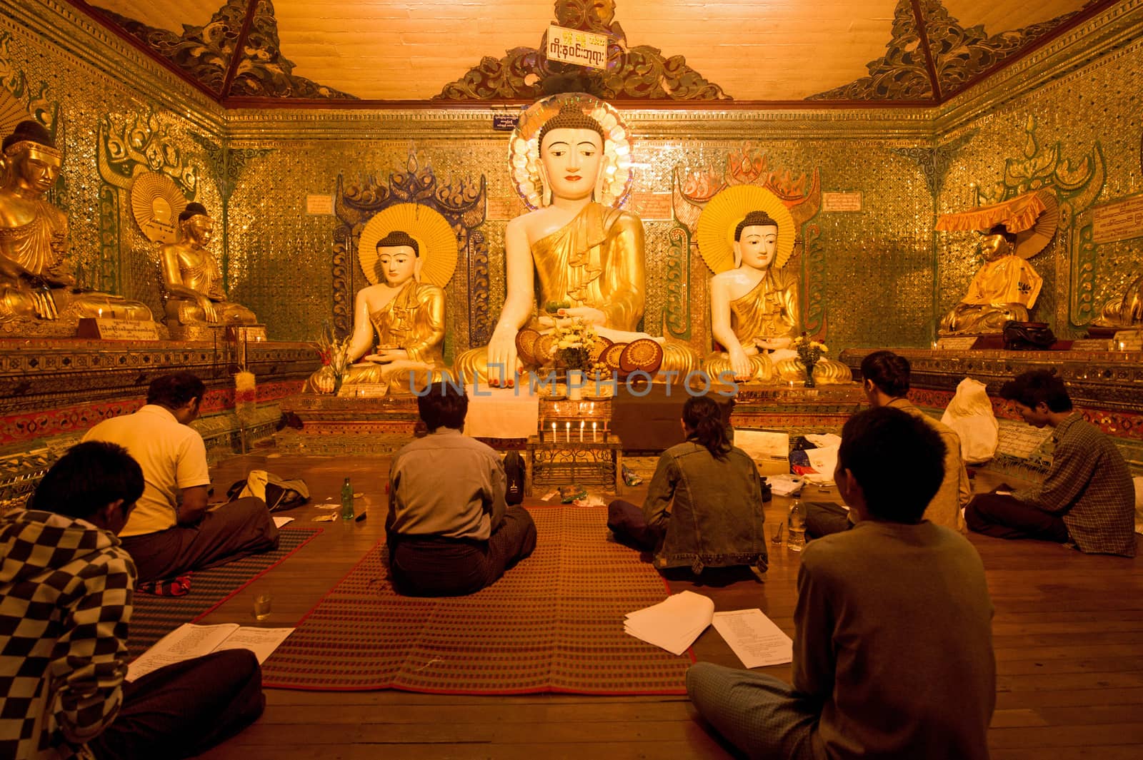 buddhism pray around Shwedagon pagoda in Yagon, Myanmar by think4photop