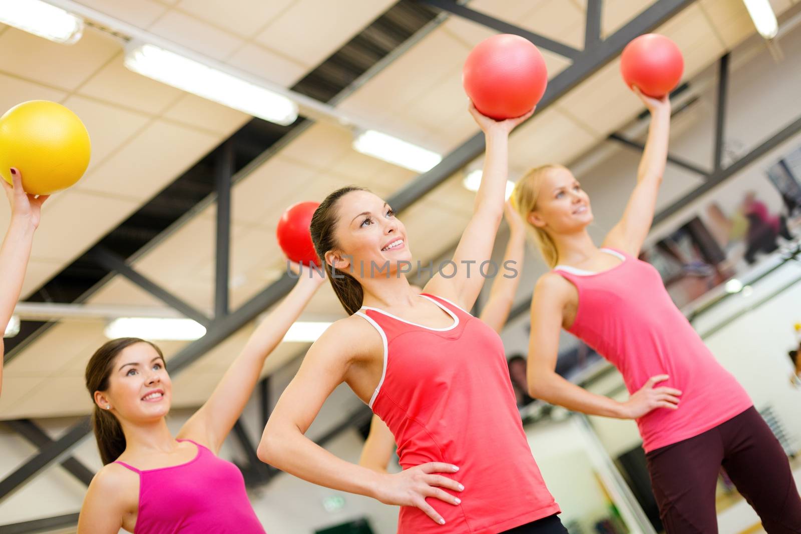 group of people working out with stability balls by dolgachov