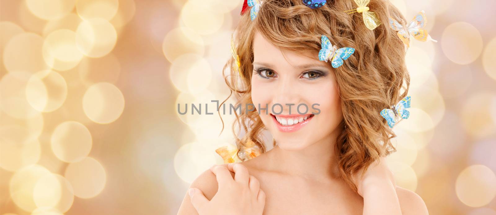 happy teenage girl with butterflies in hair by dolgachov