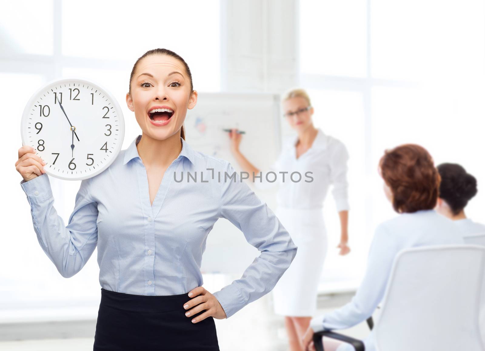 attractive businesswoman with wall clock by dolgachov