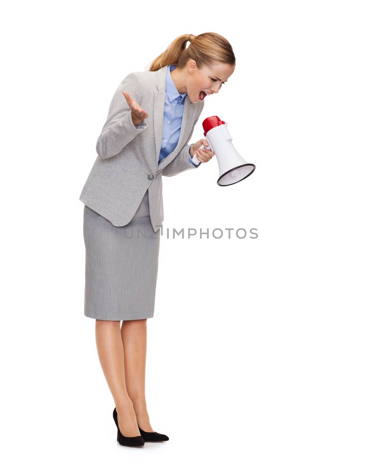 business, communication and office concept - angry businesswoman with megaphone screaming at someone imaginary