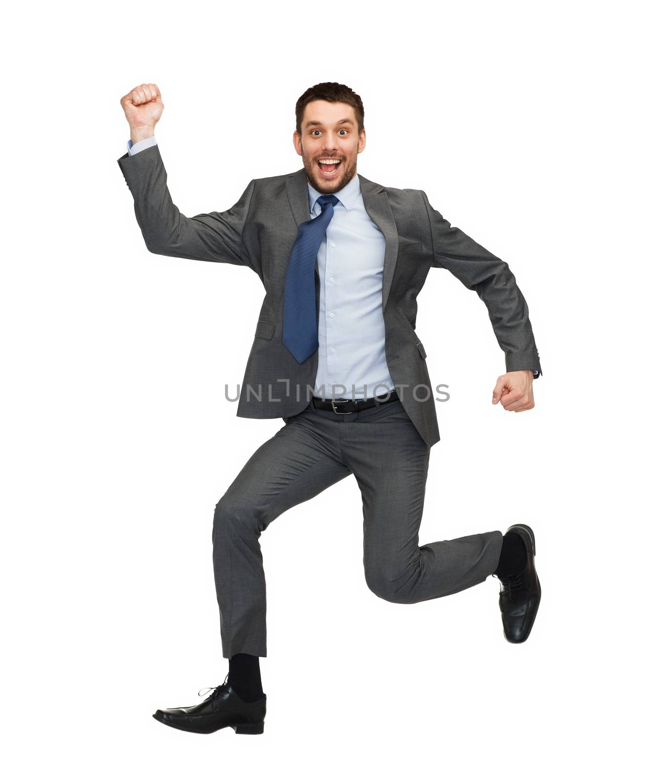 smiling businessman jumping by dolgachov