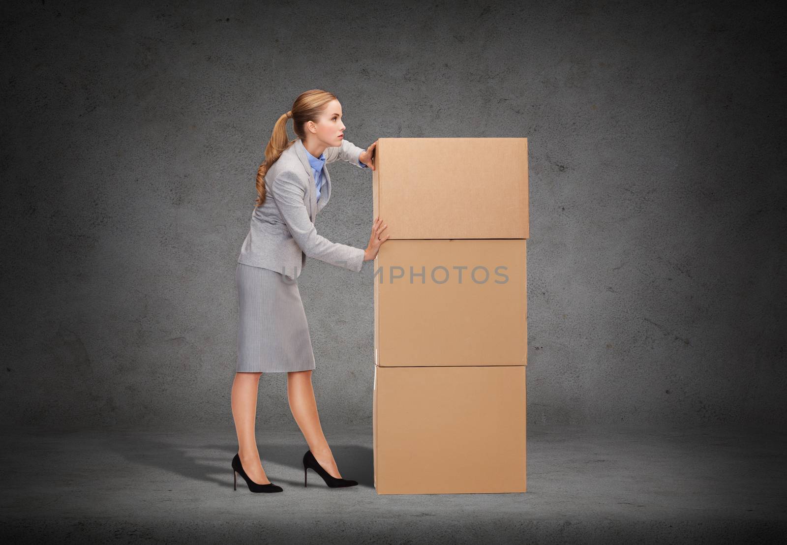 busy businesswoman pushing tower of cardboards by dolgachov