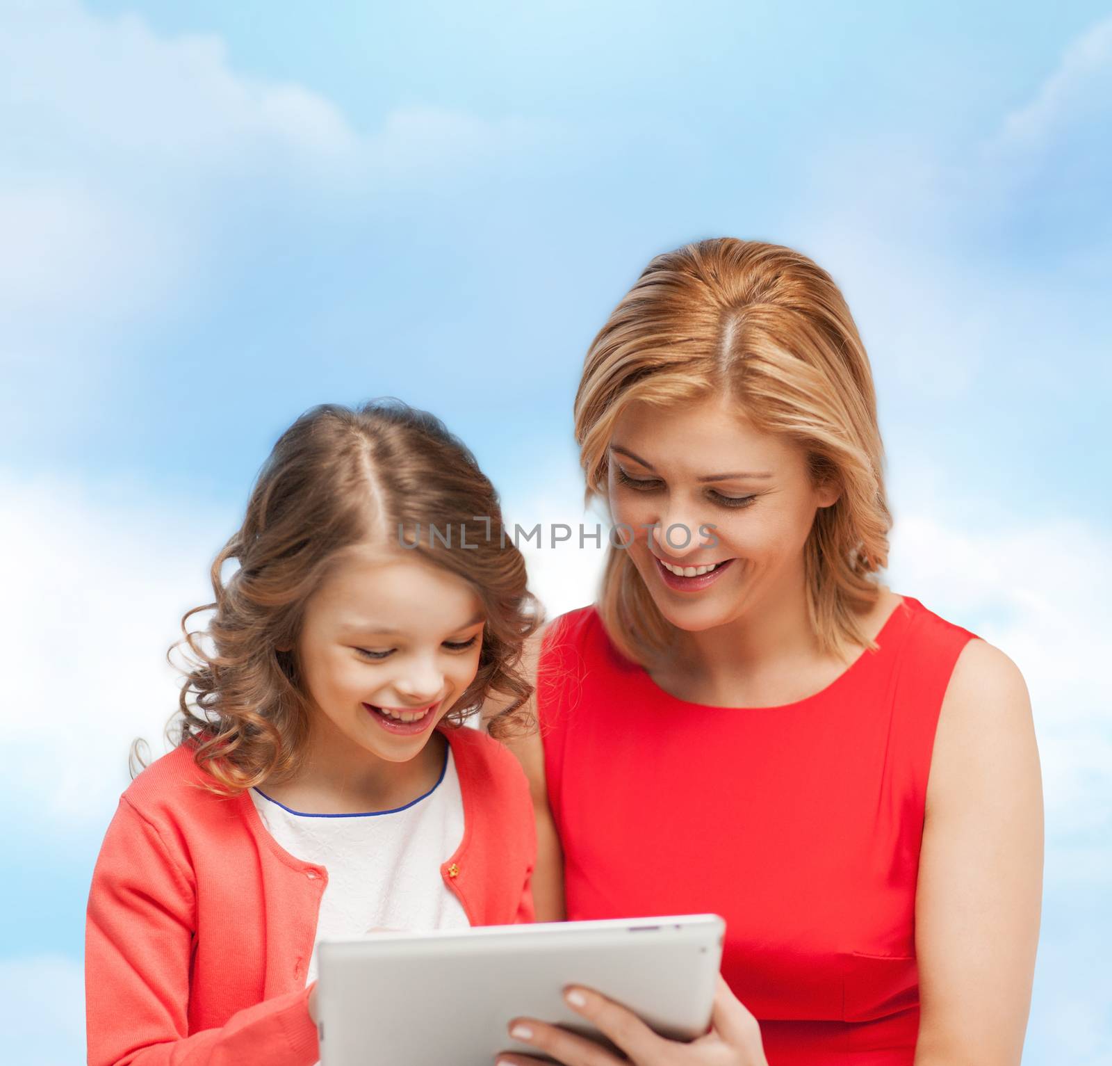 family, child and technology concpt - smiling mother and daughter with tablet pc computer