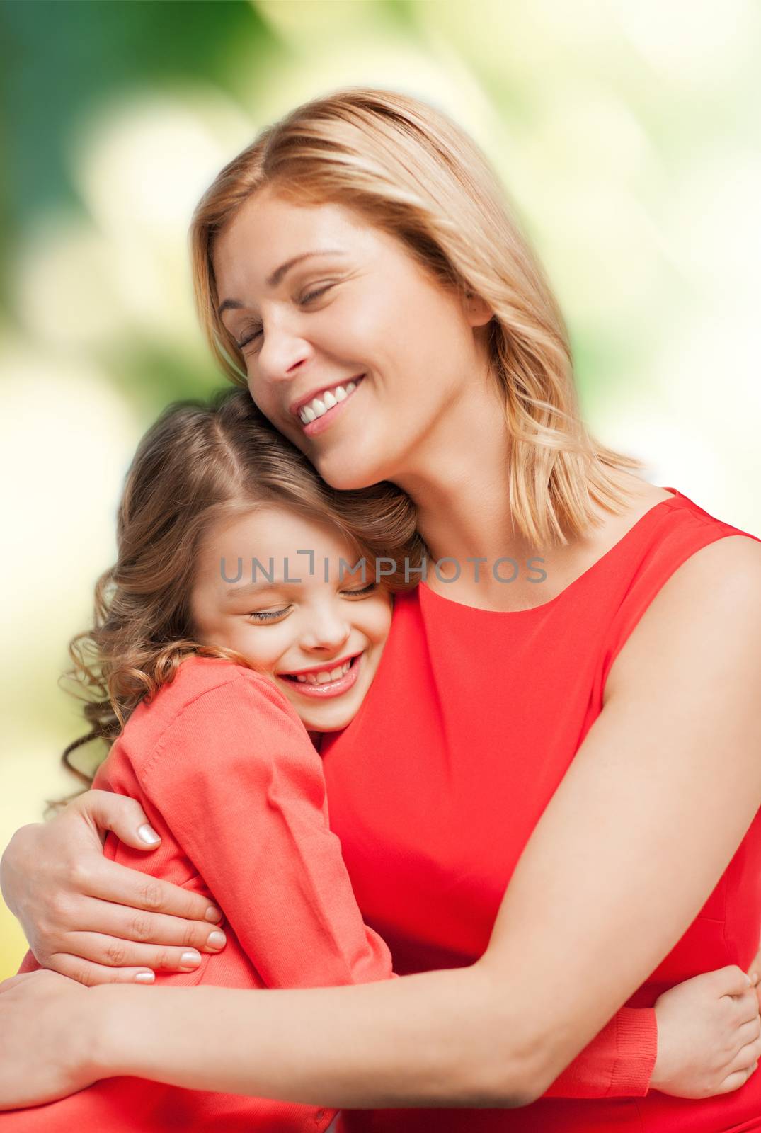 smiling mother and daughter hugging by dolgachov