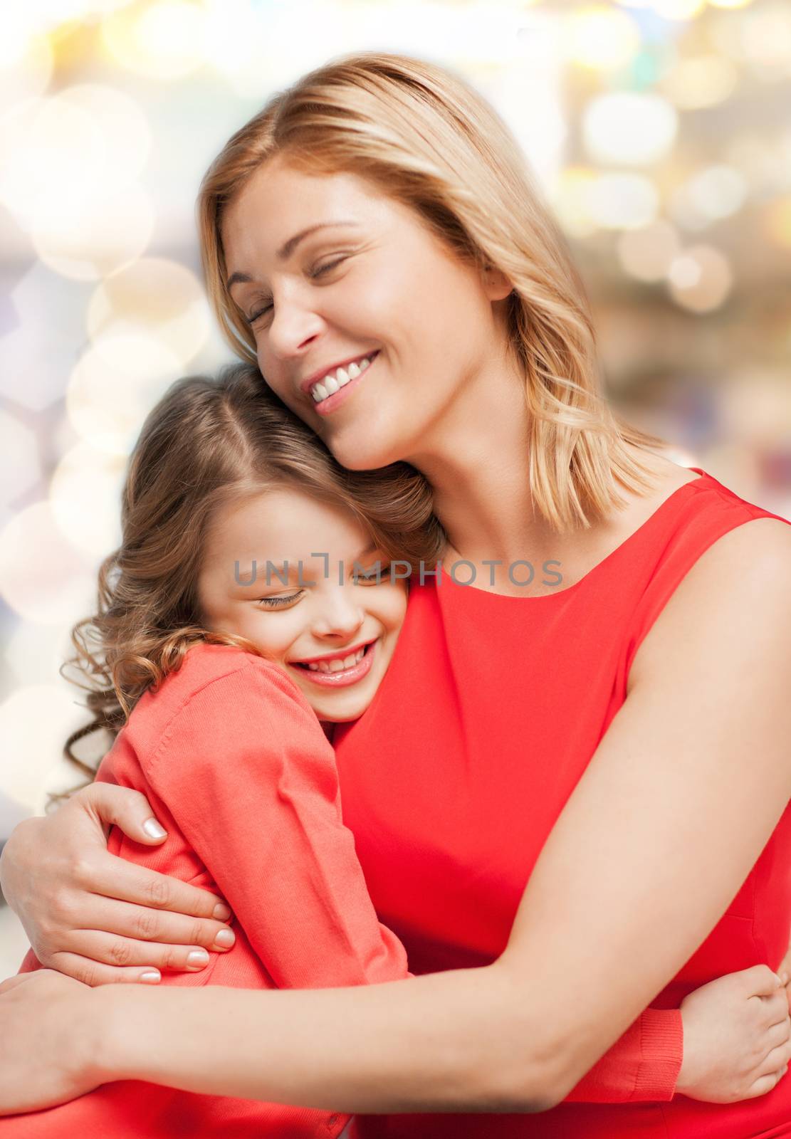 smiling mother and daughter hugging by dolgachov