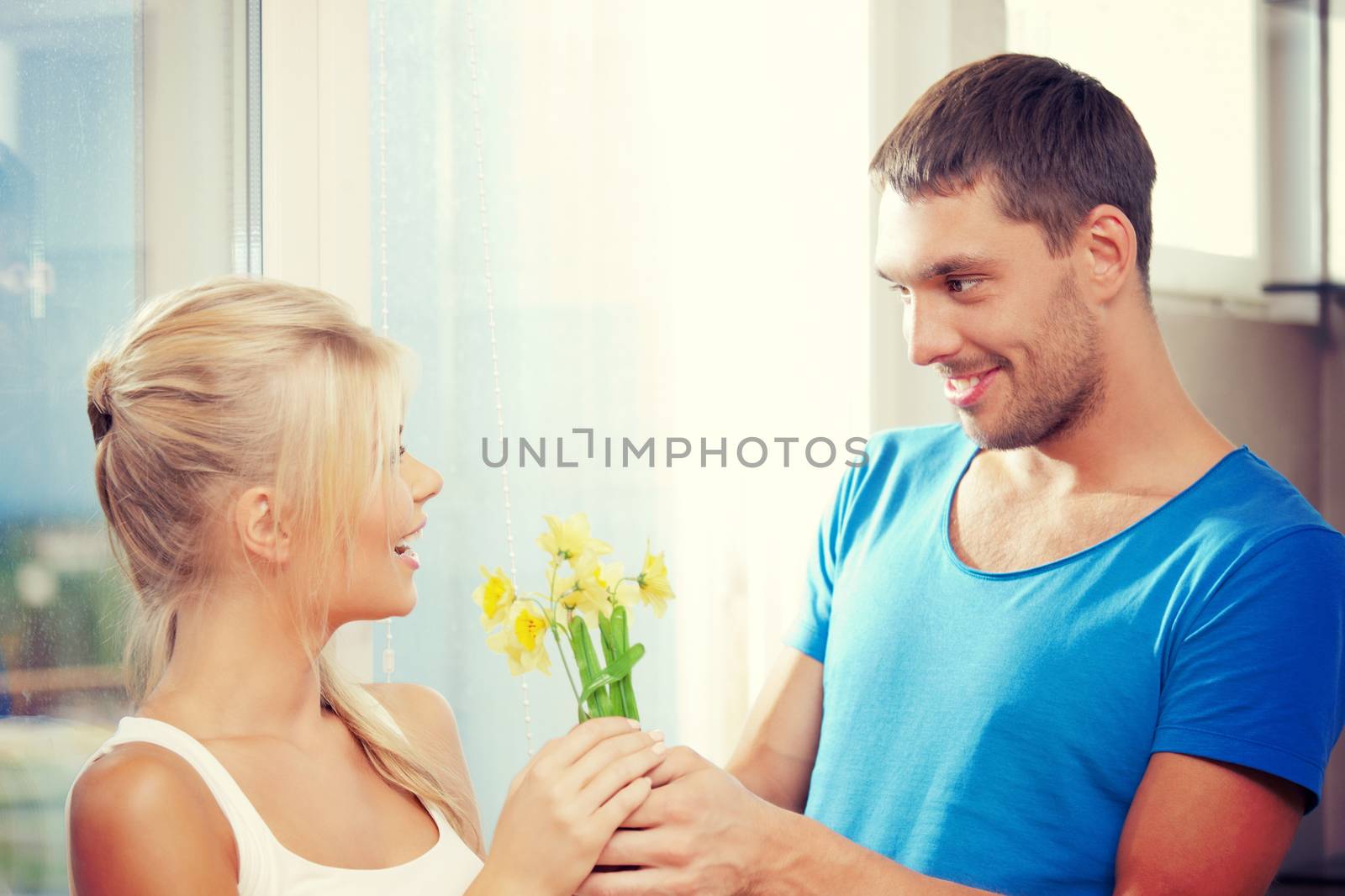 romantic couple with flowers by dolgachov