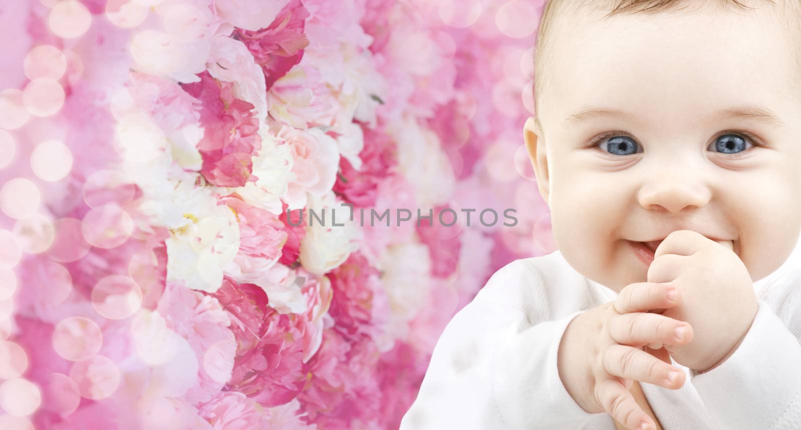 child, happiness and people concept - adorable baby