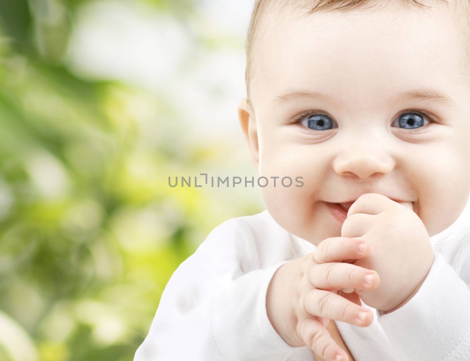 child, happiness and people concept - adorable baby