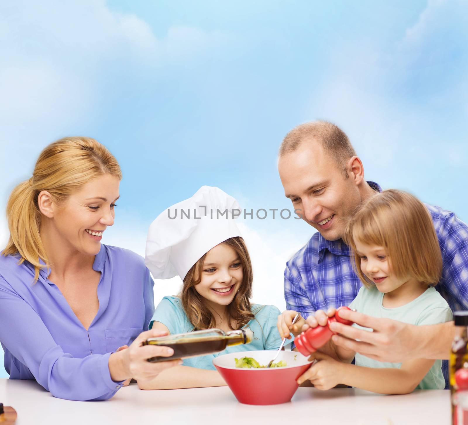 happy family with two kids eating at home by dolgachov
