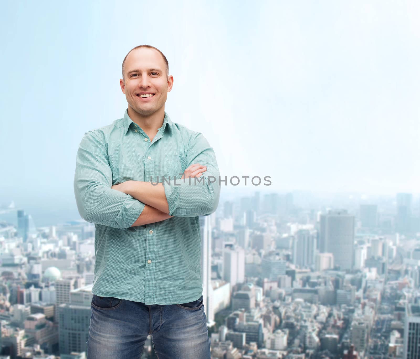 smiling man with crossed arms by dolgachov