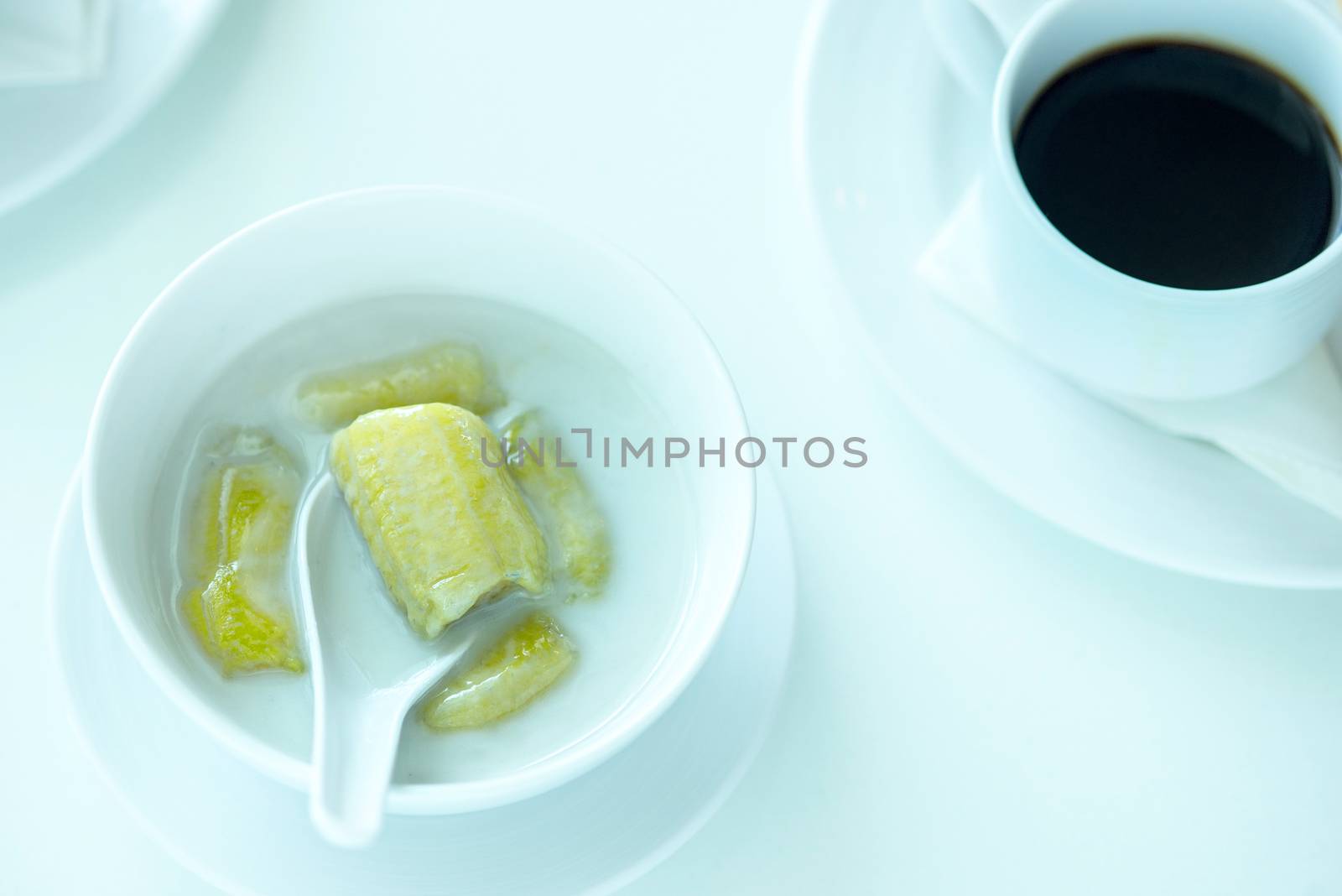 banana in coconut milk,Sweet yellow banana Topped with coconut milk is the famous dessert Thailand