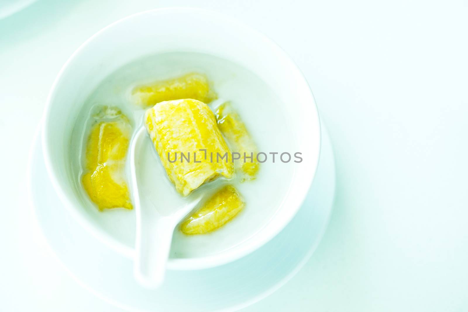 banana in coconut milk,Sweet yellow banana Topped with coconut milk is the famous dessert Thailand