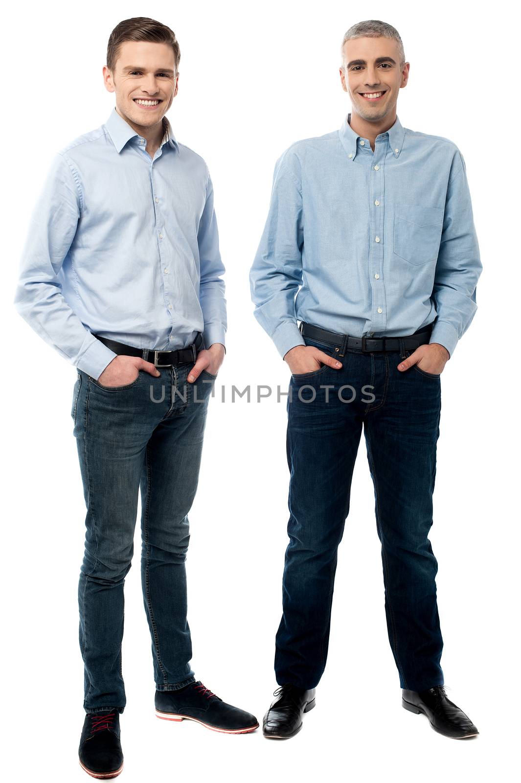 Two executives standing and hand in pockets