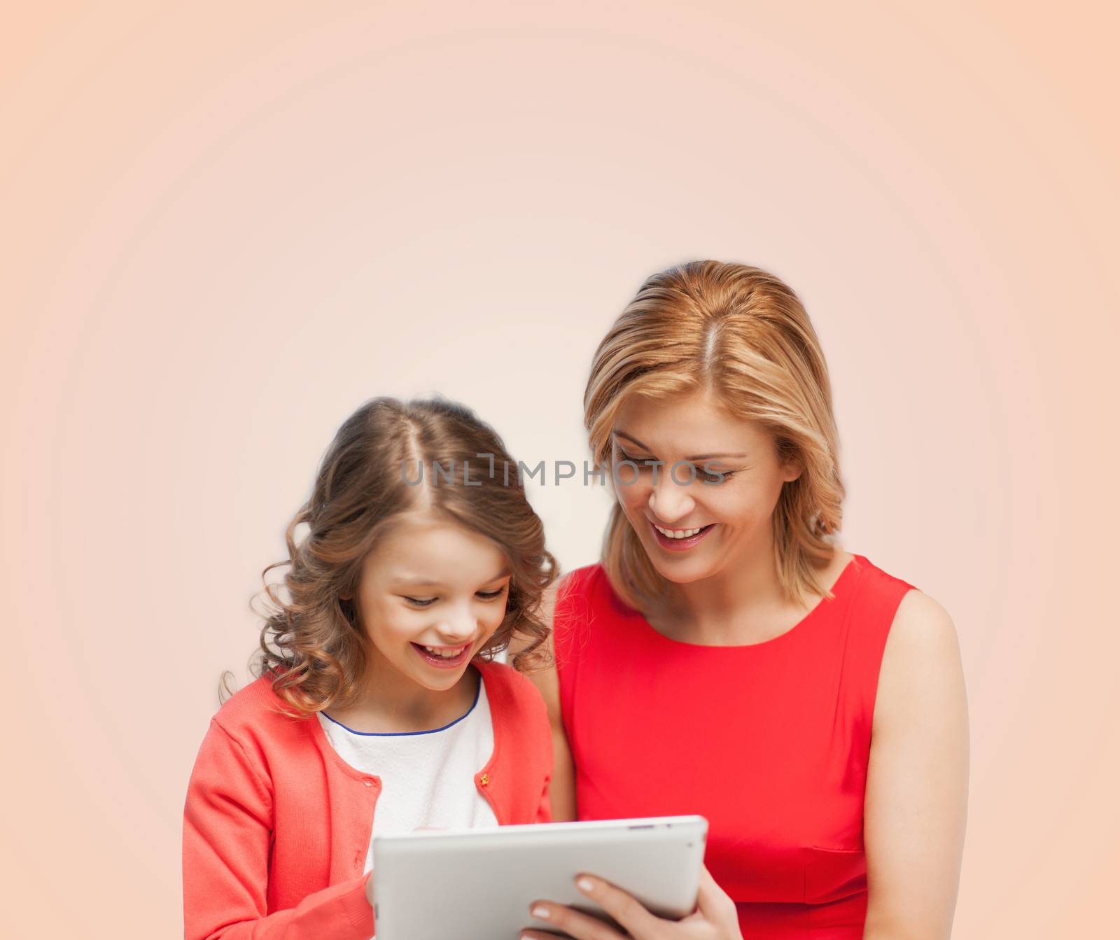 mother and daughter with tablet pc computer by dolgachov