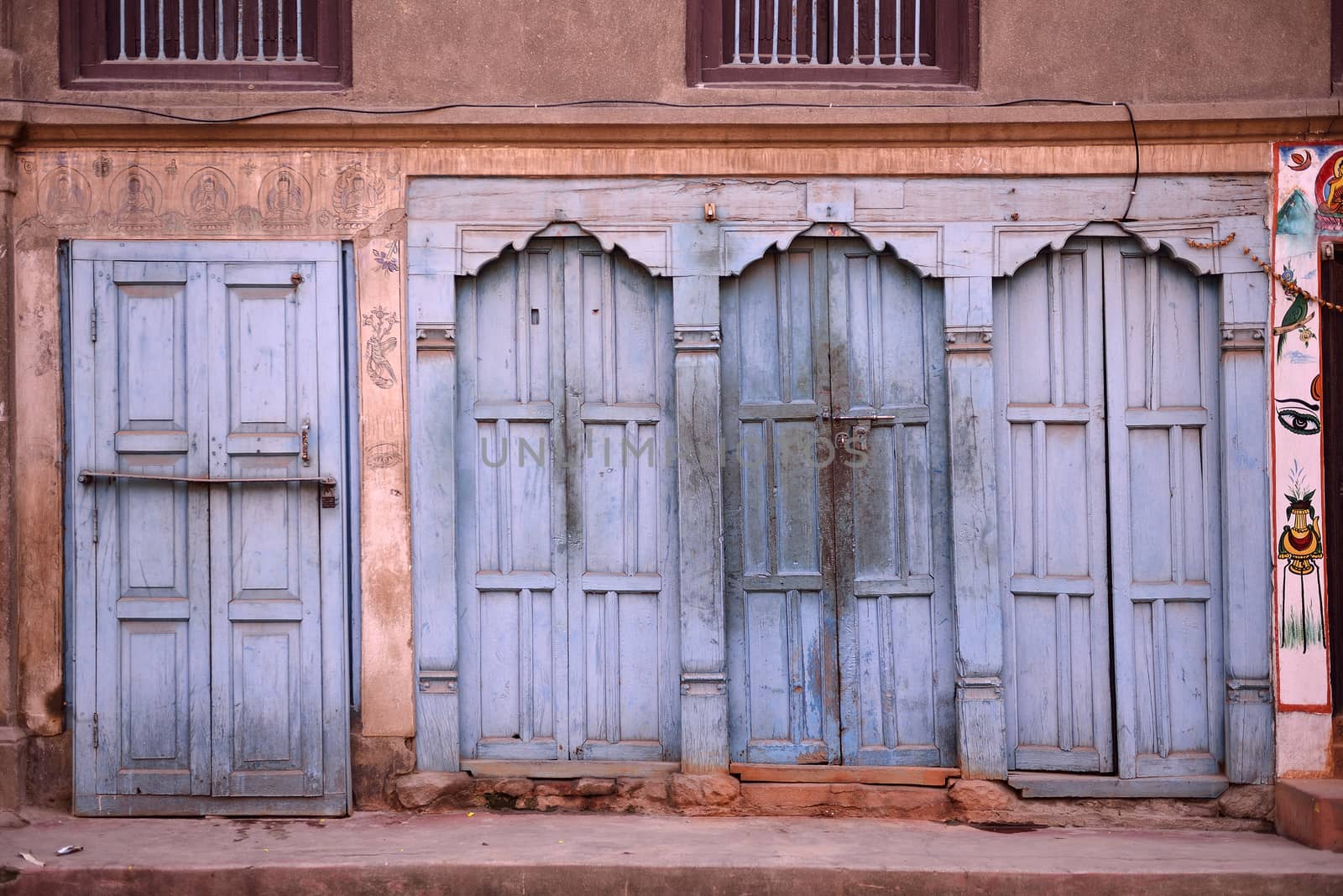 Beautiful doors and classic windows in native house of Nepal by think4photop