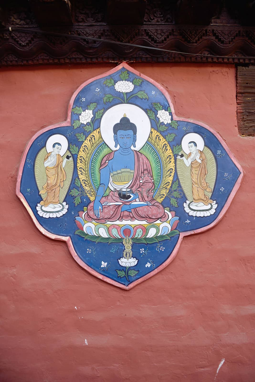 Blue Buddha portrait painting on red wall , Nepal