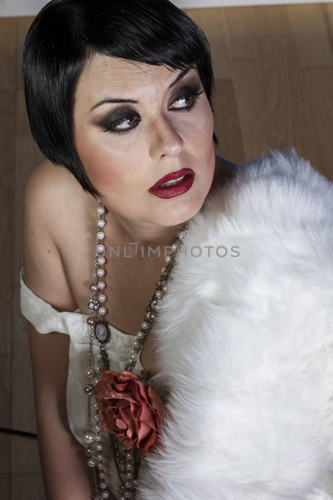 Sexy brunette woman dressed in 20s style