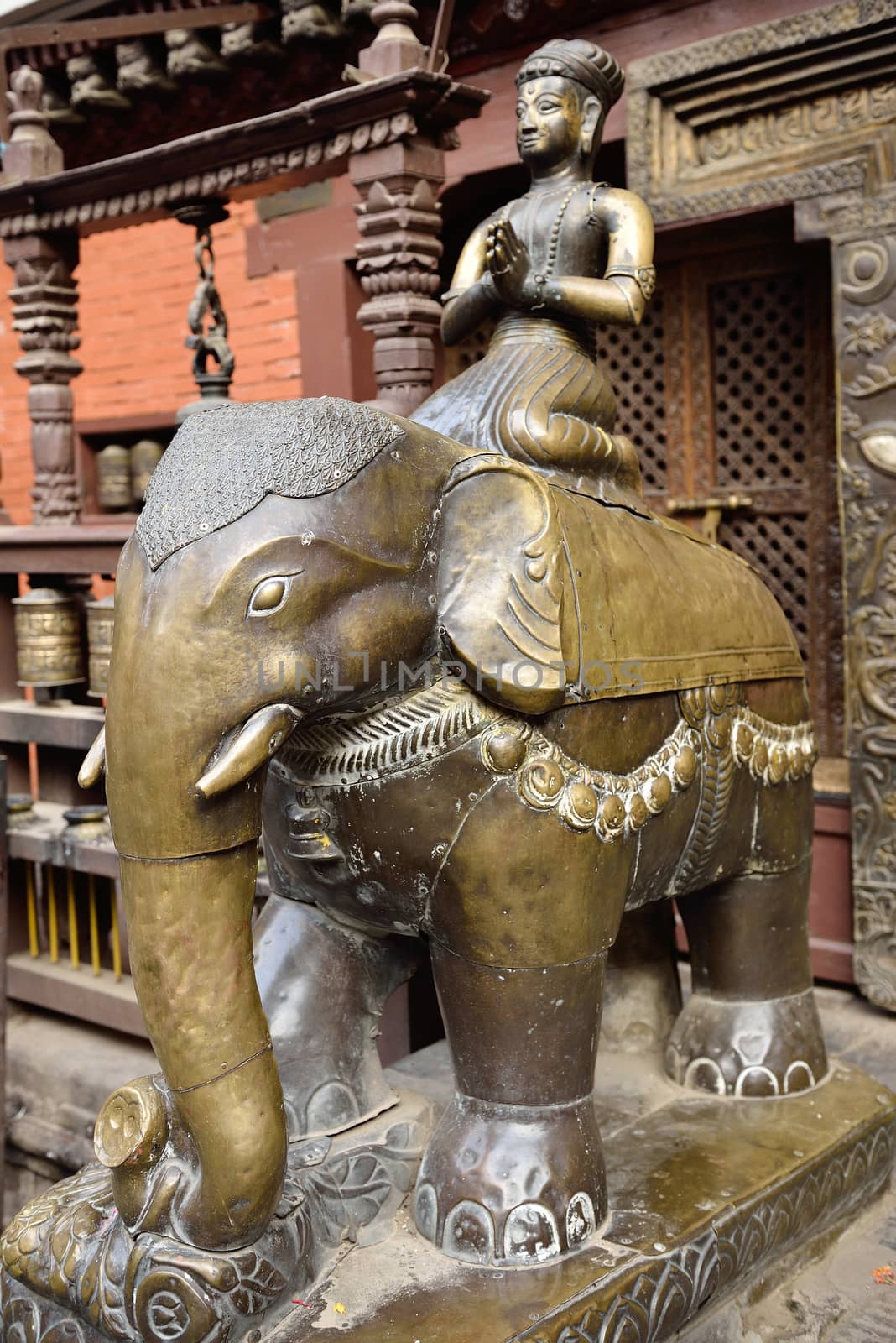 elephant figures in the beautiful golden temple in patan, nepal by think4photop