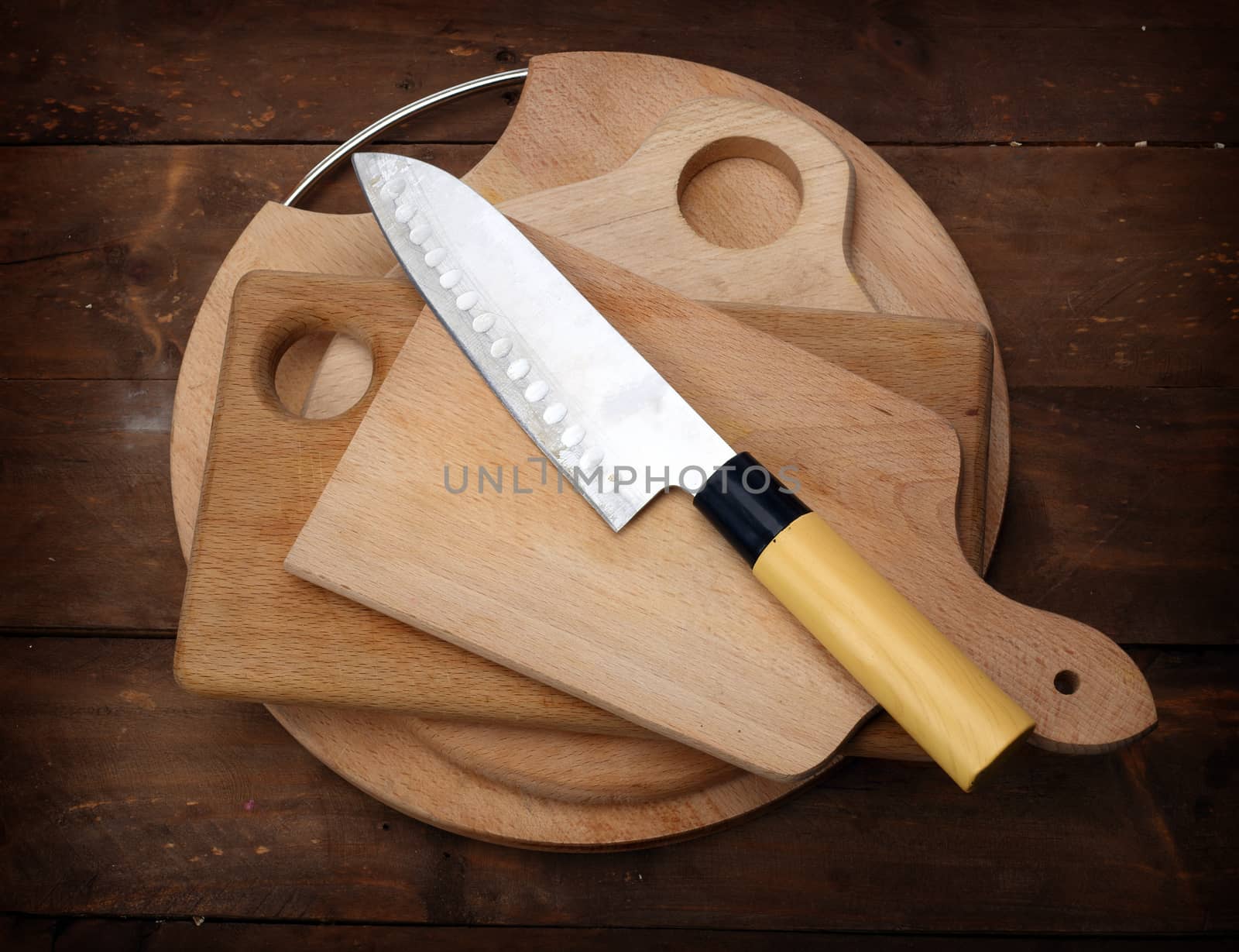  kitchen knife on stack of kitchen planks