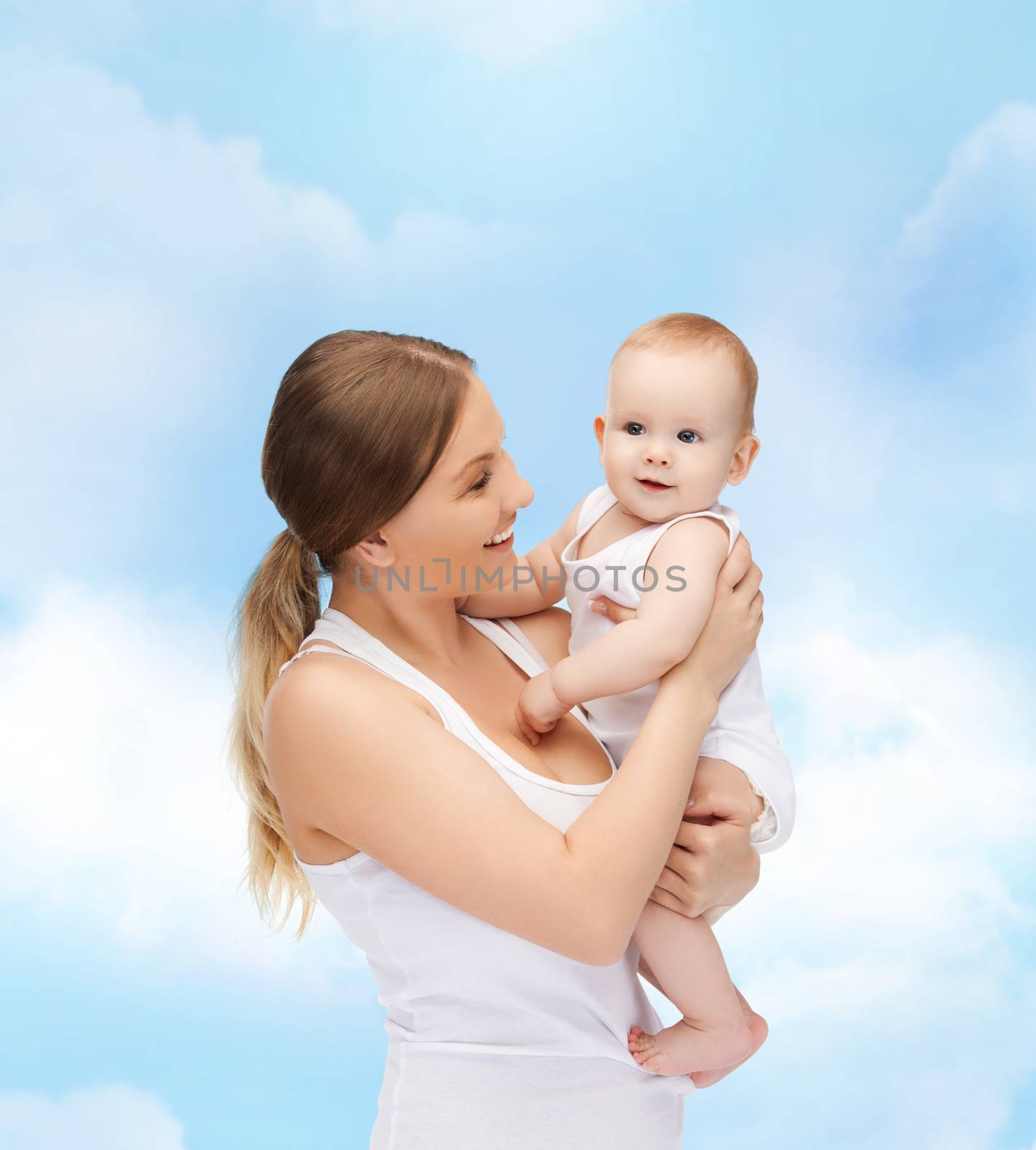 family, child and happiness concept - happy mother with adorable baby