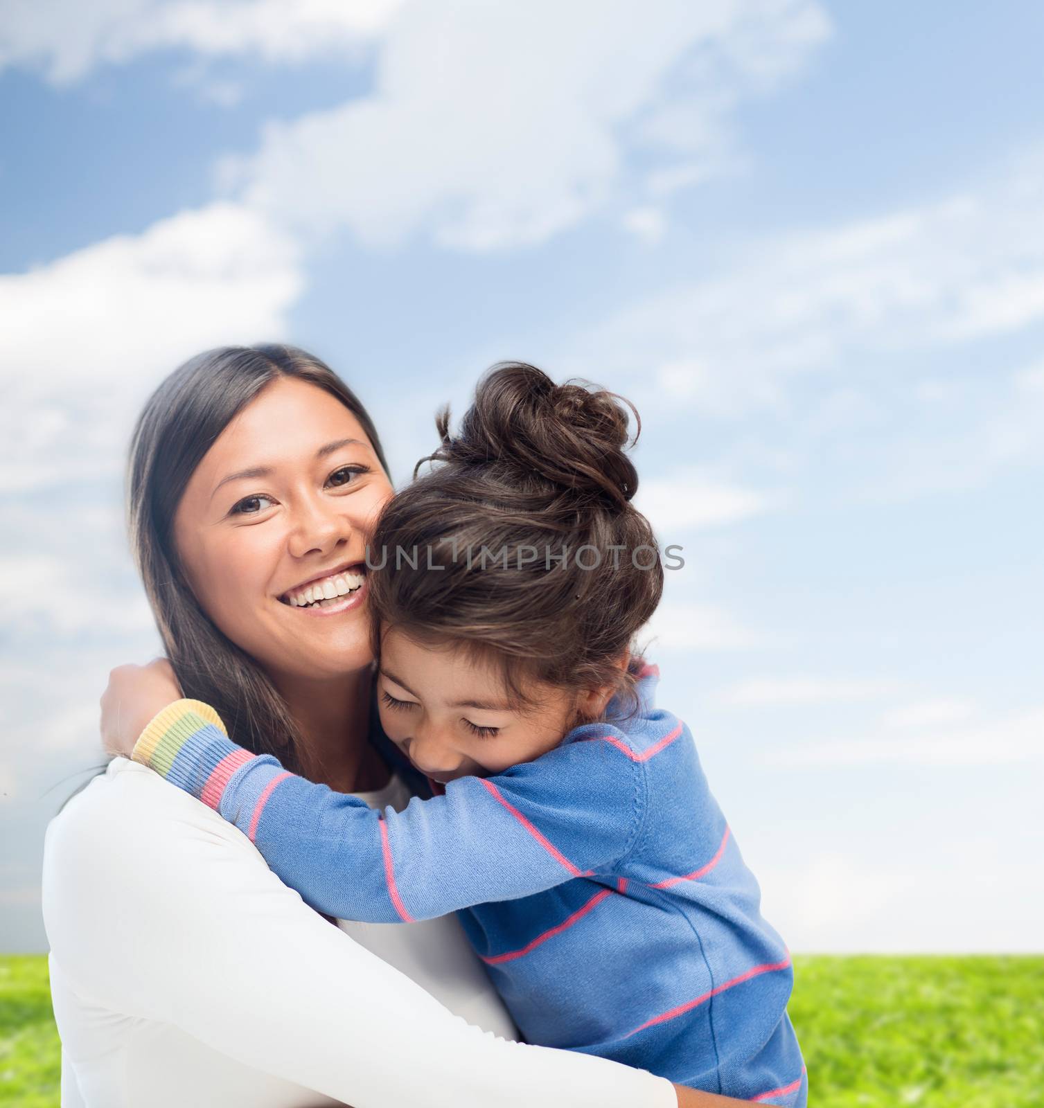 family, children and happy people concept - hugging mother and daughter