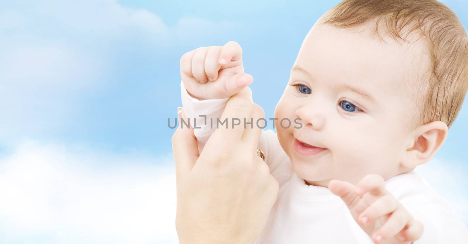 child, happiness and people concept - adorable baby boy