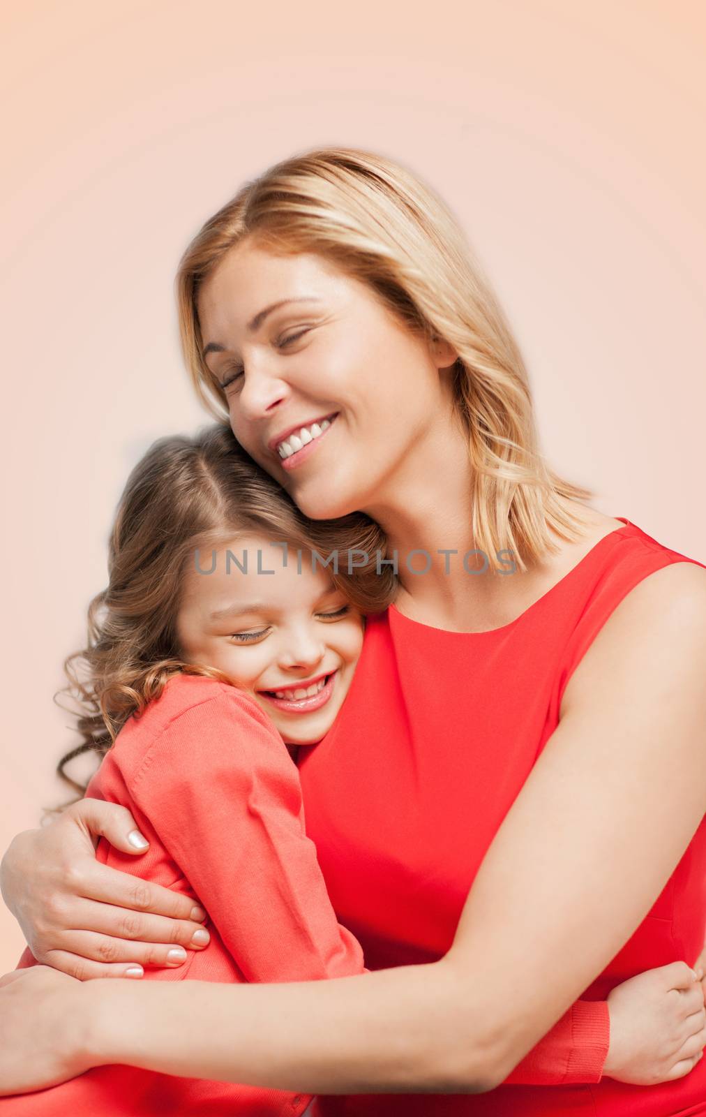 family, child and happiness concept - hugging mother and daughter