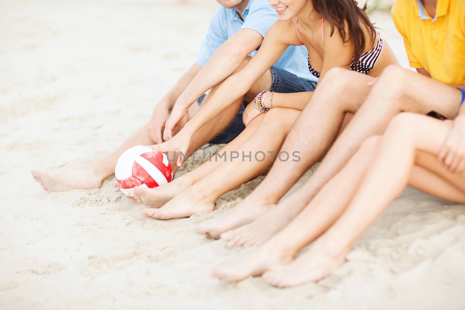 teenager friends or volleyball team having fun by dolgachov