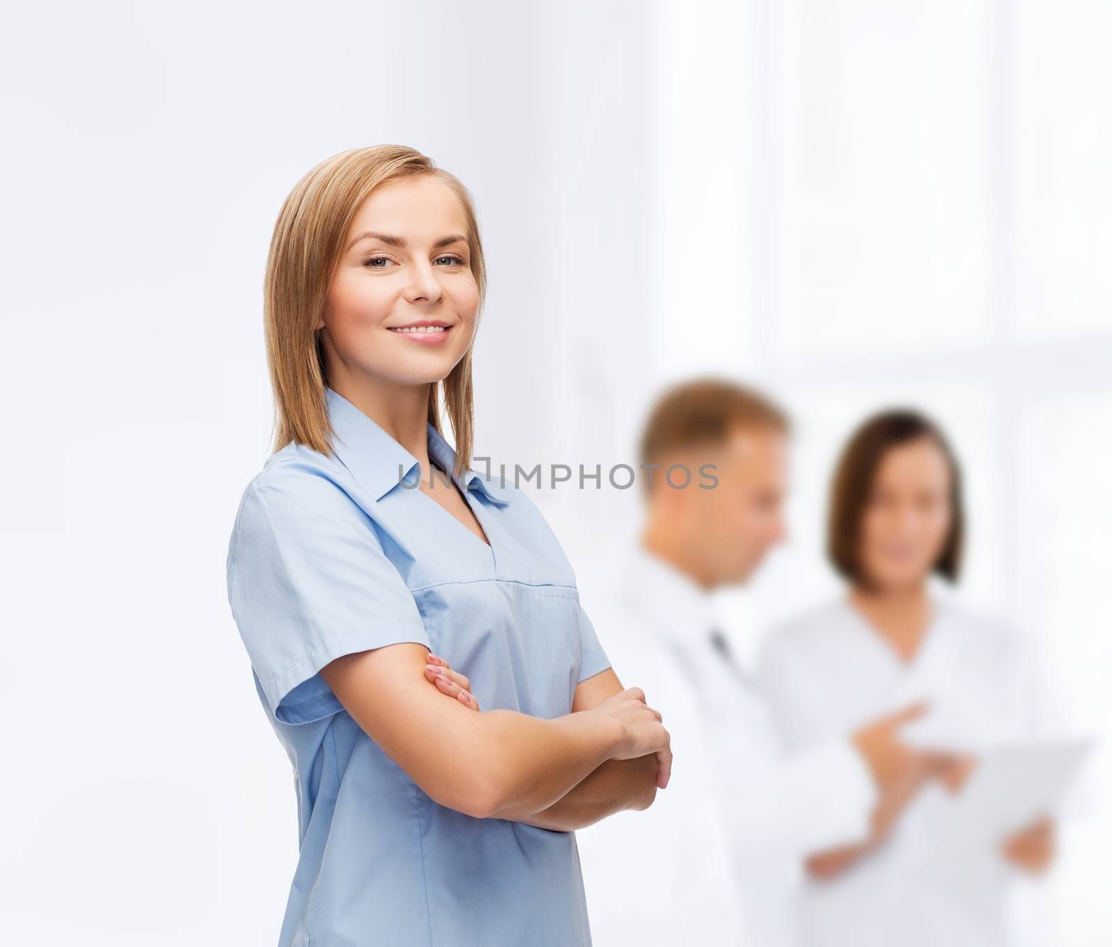 smiling female doctor or nurse by dolgachov