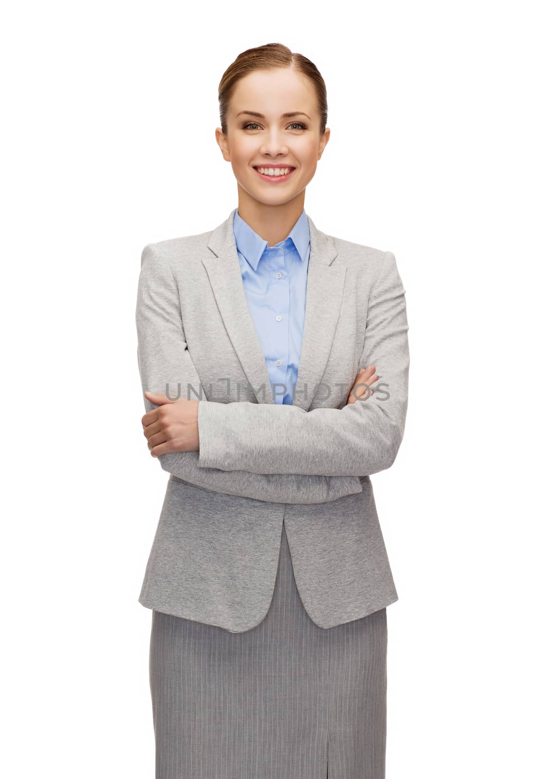 business and education concept - friendly young smiling businesswoman with crossed arms