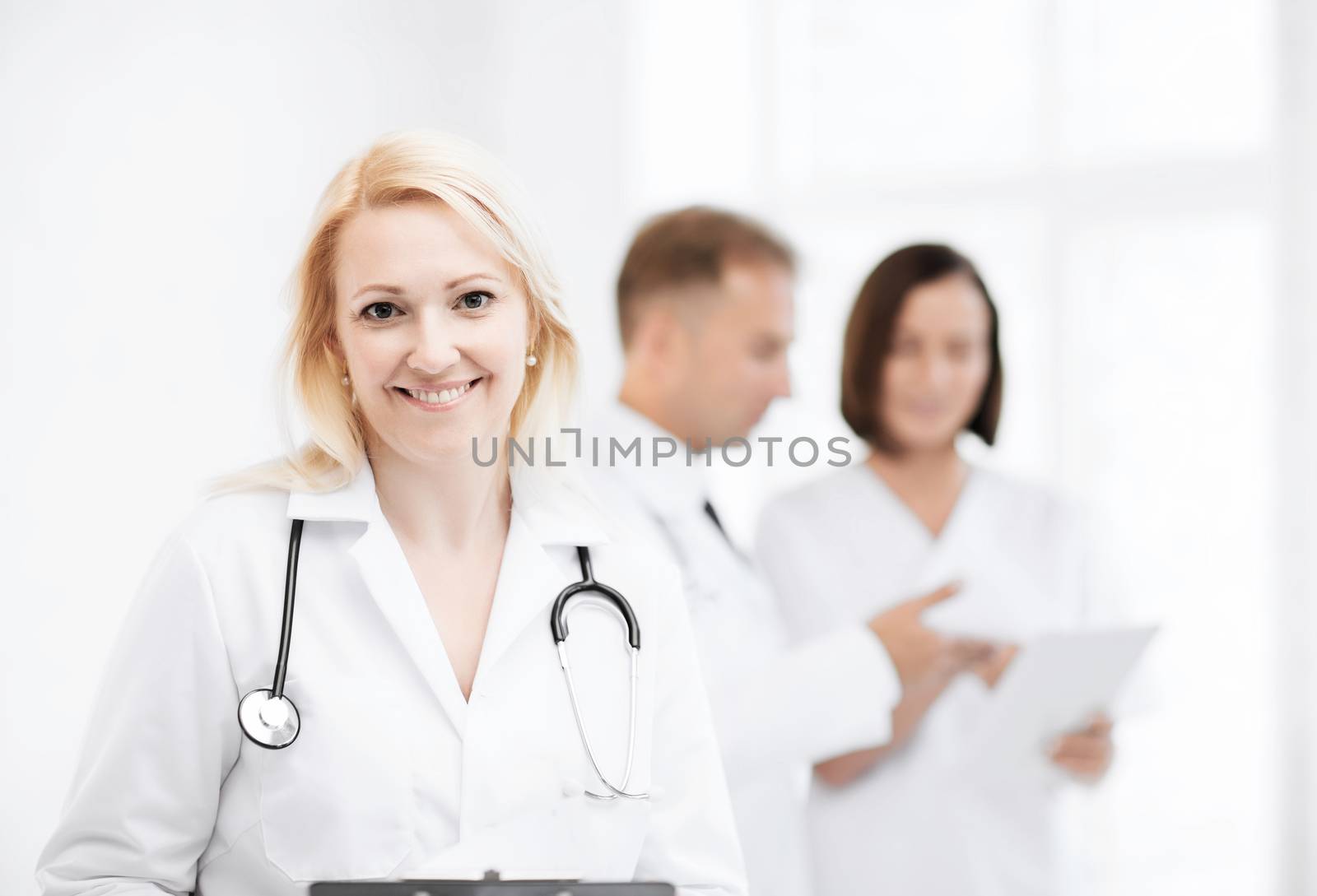 female doctor with stethoscope by dolgachov