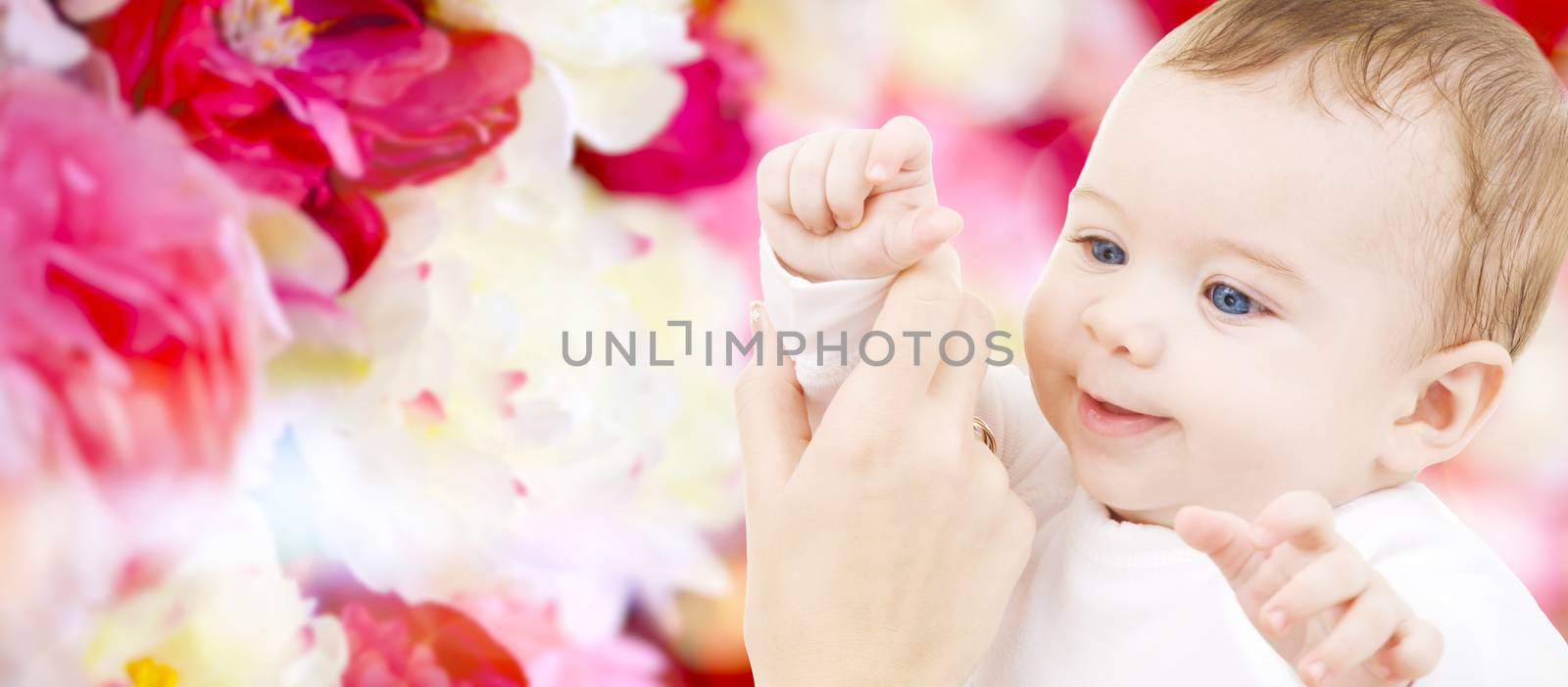 child, happiness and people concept - adorable baby boy