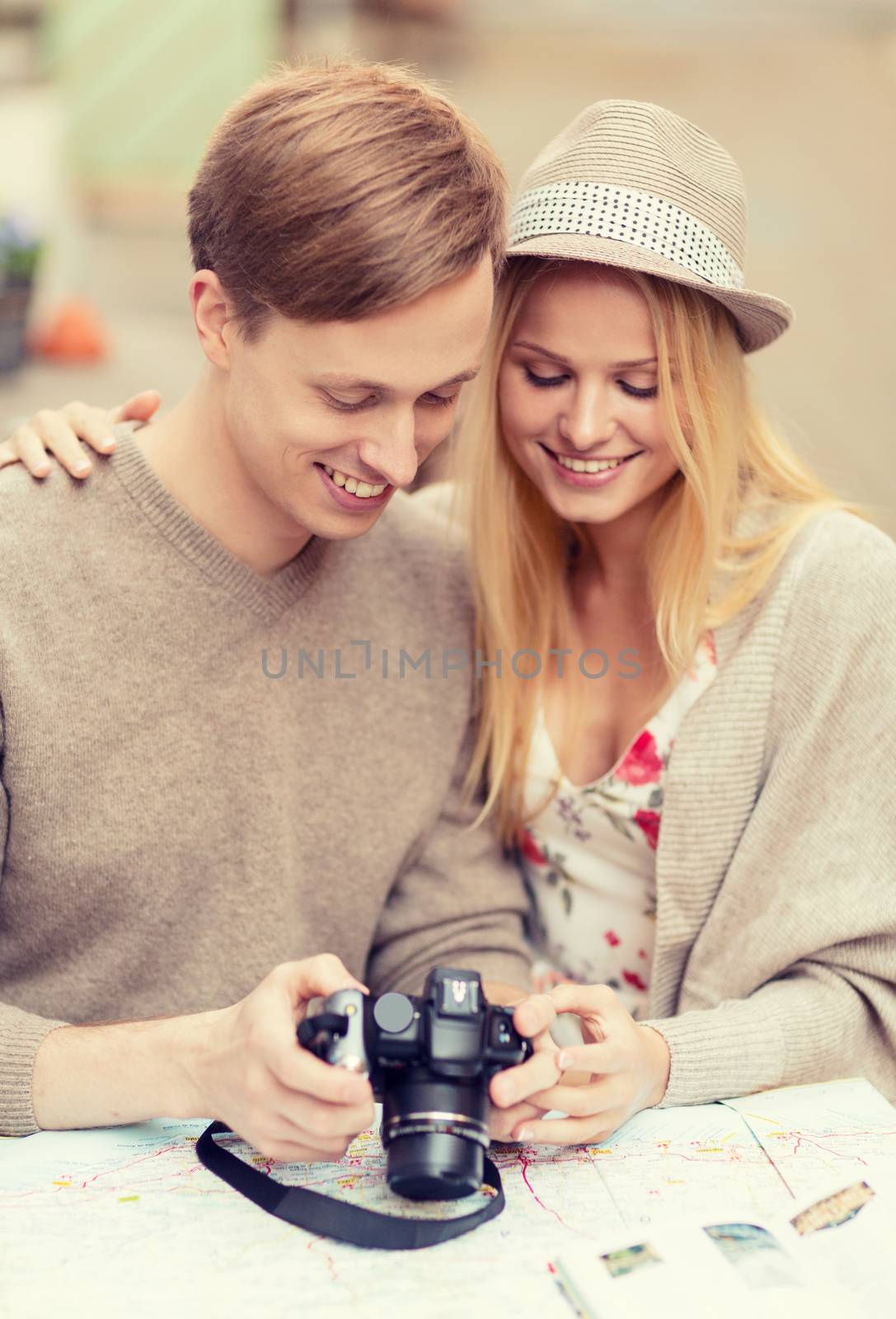 couple with photo camera by dolgachov