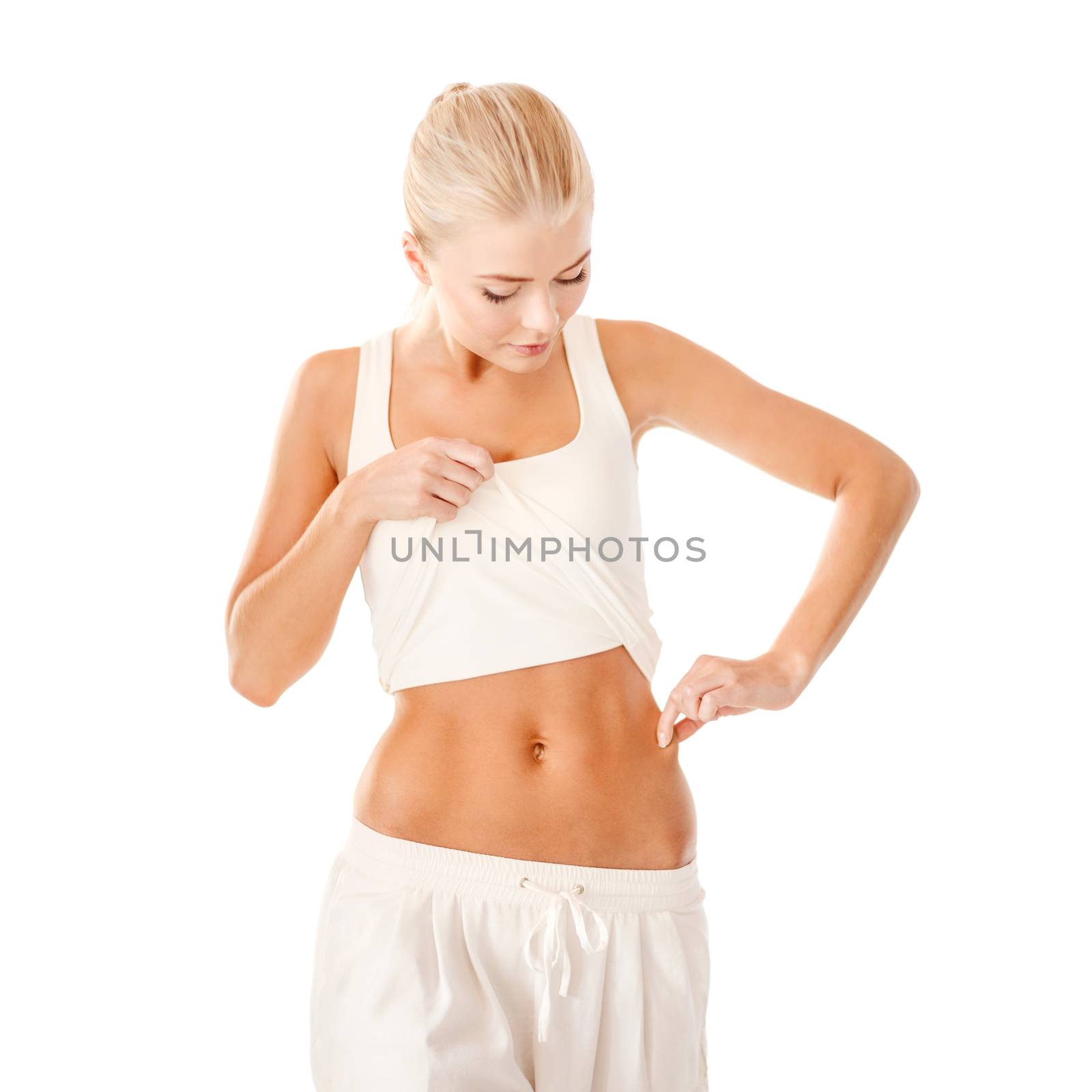 fit woman measuring fat level on her waist by dolgachov