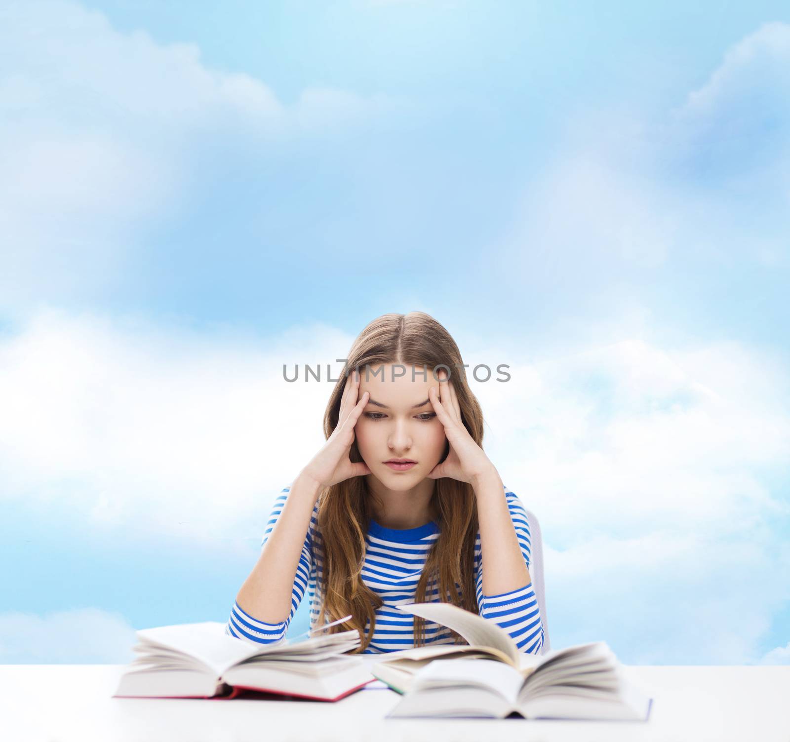 education and home concept - stressed student girl with books