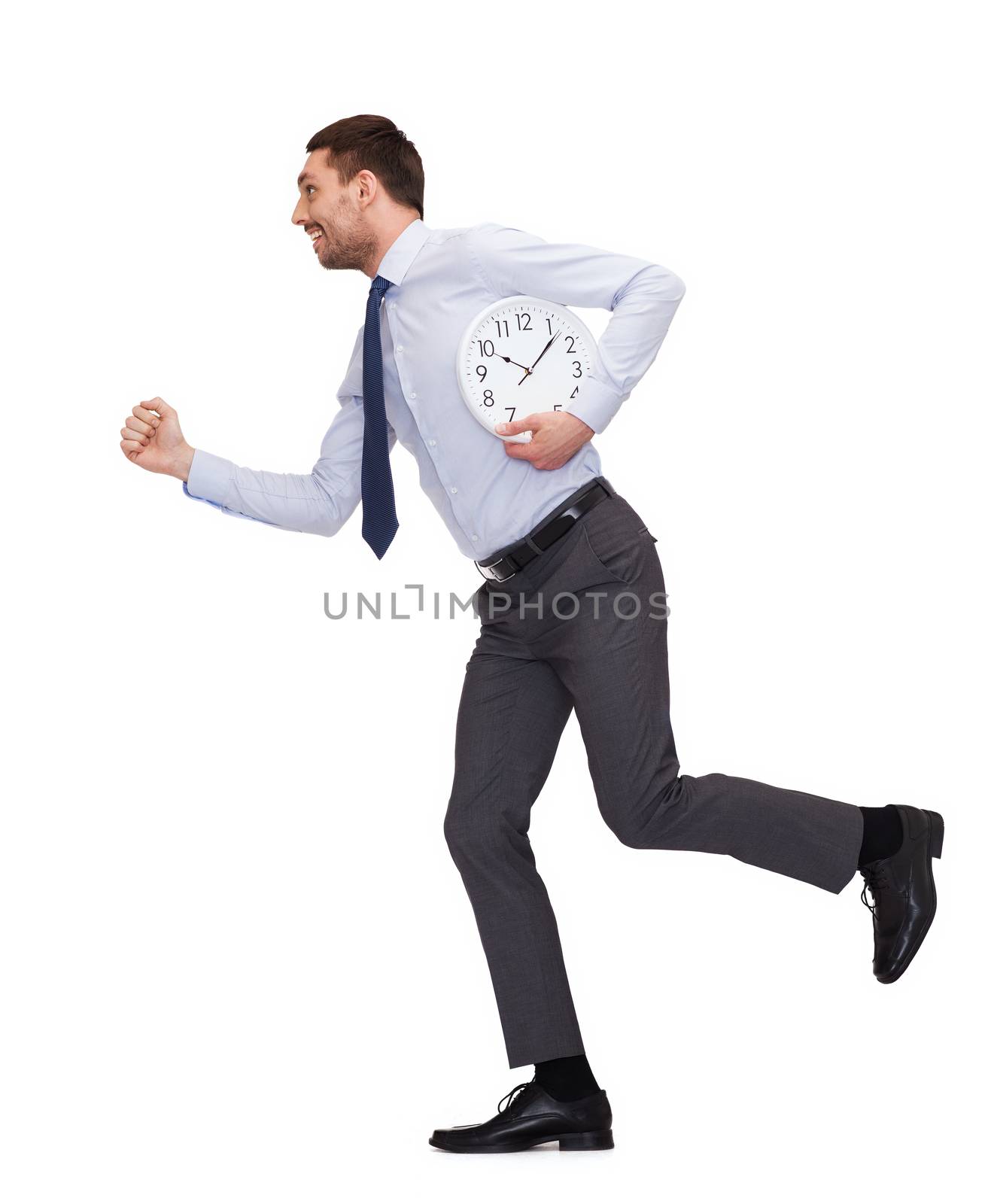 smiling young businessman with clock running by dolgachov