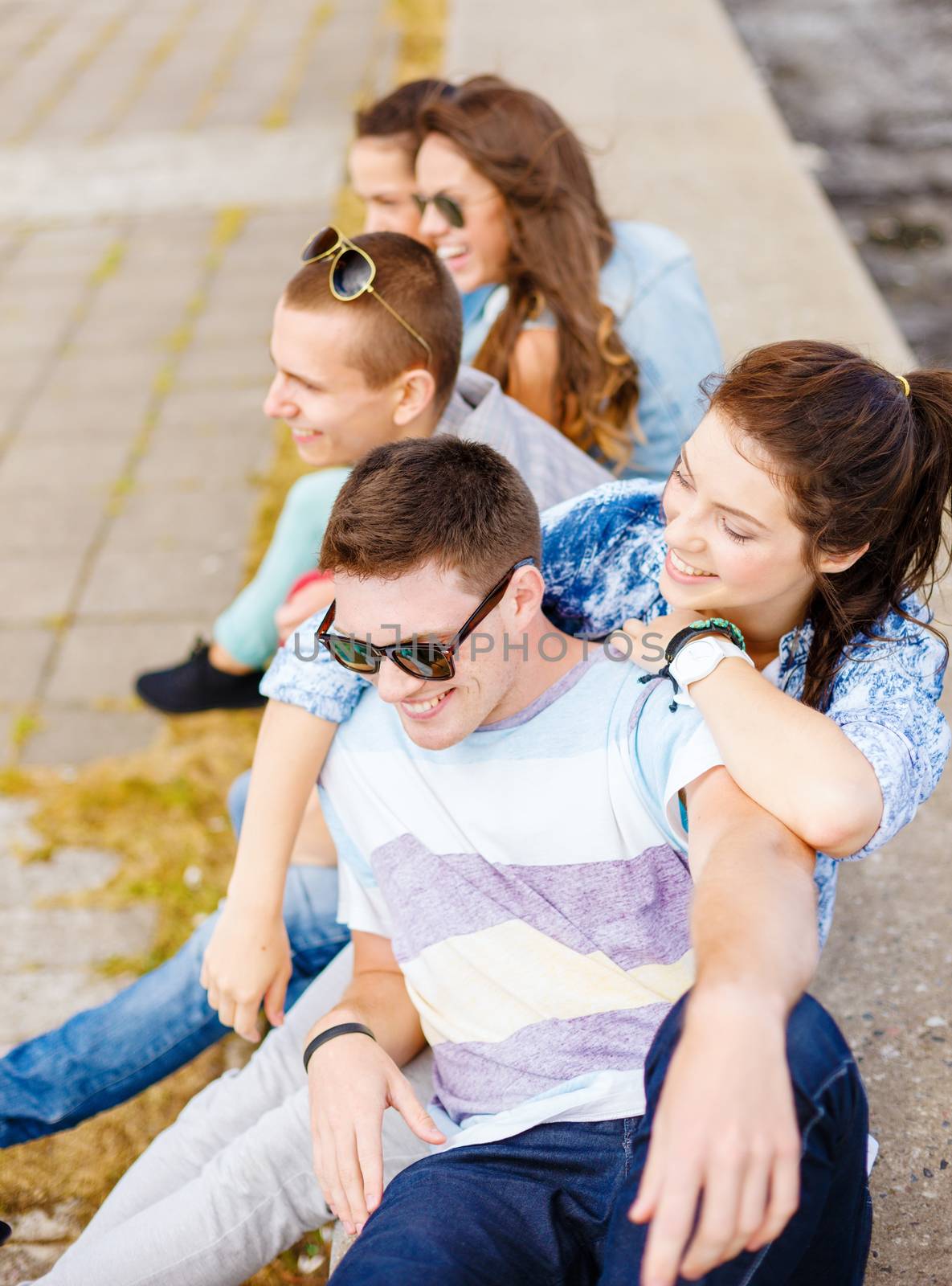 group of smiling teenagers hanging out by dolgachov