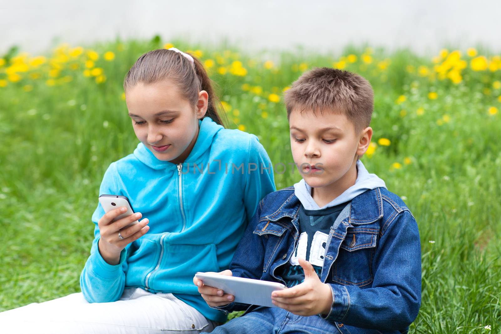 two children with gadgets by vsurkov
