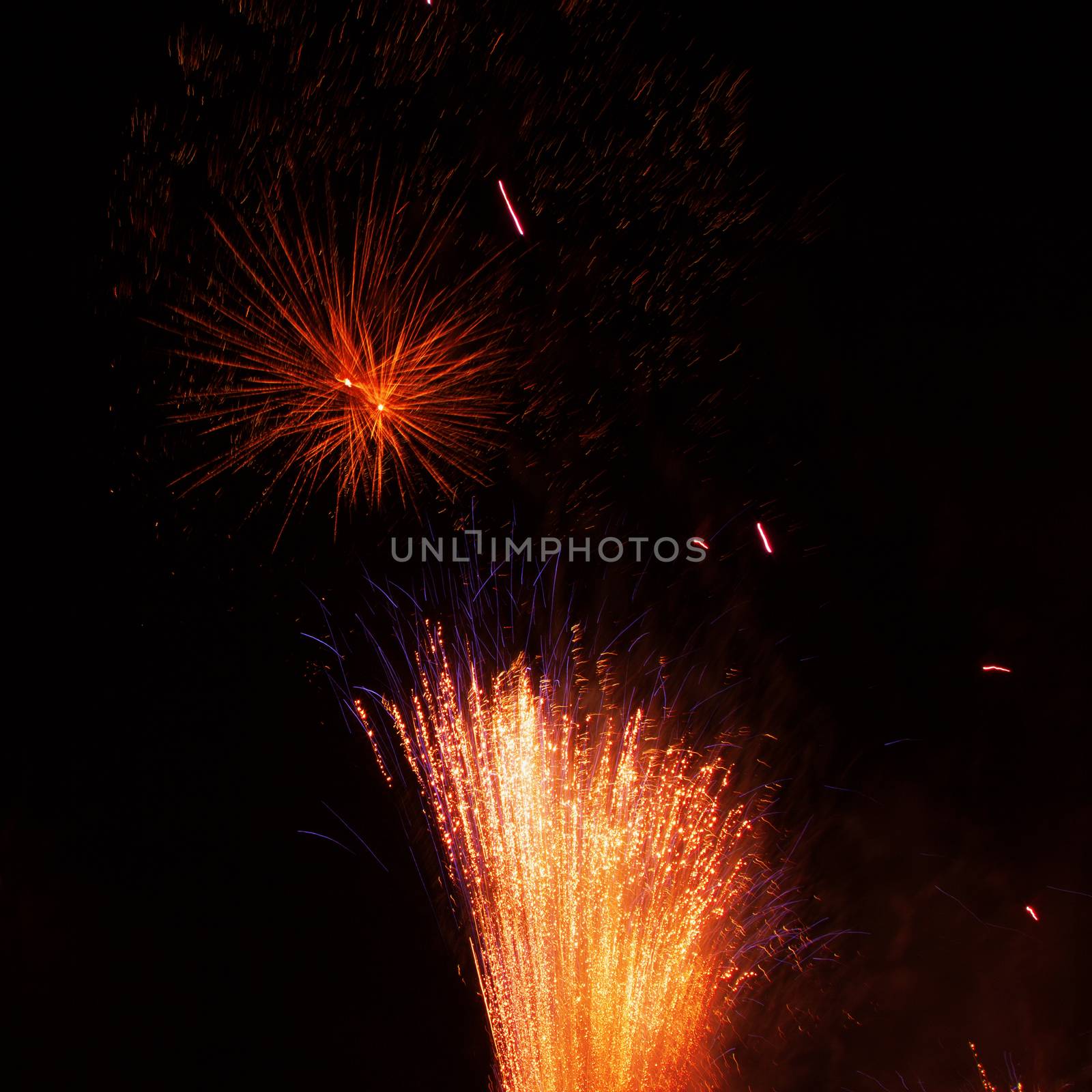 Fireworks exploding in the dark night sky