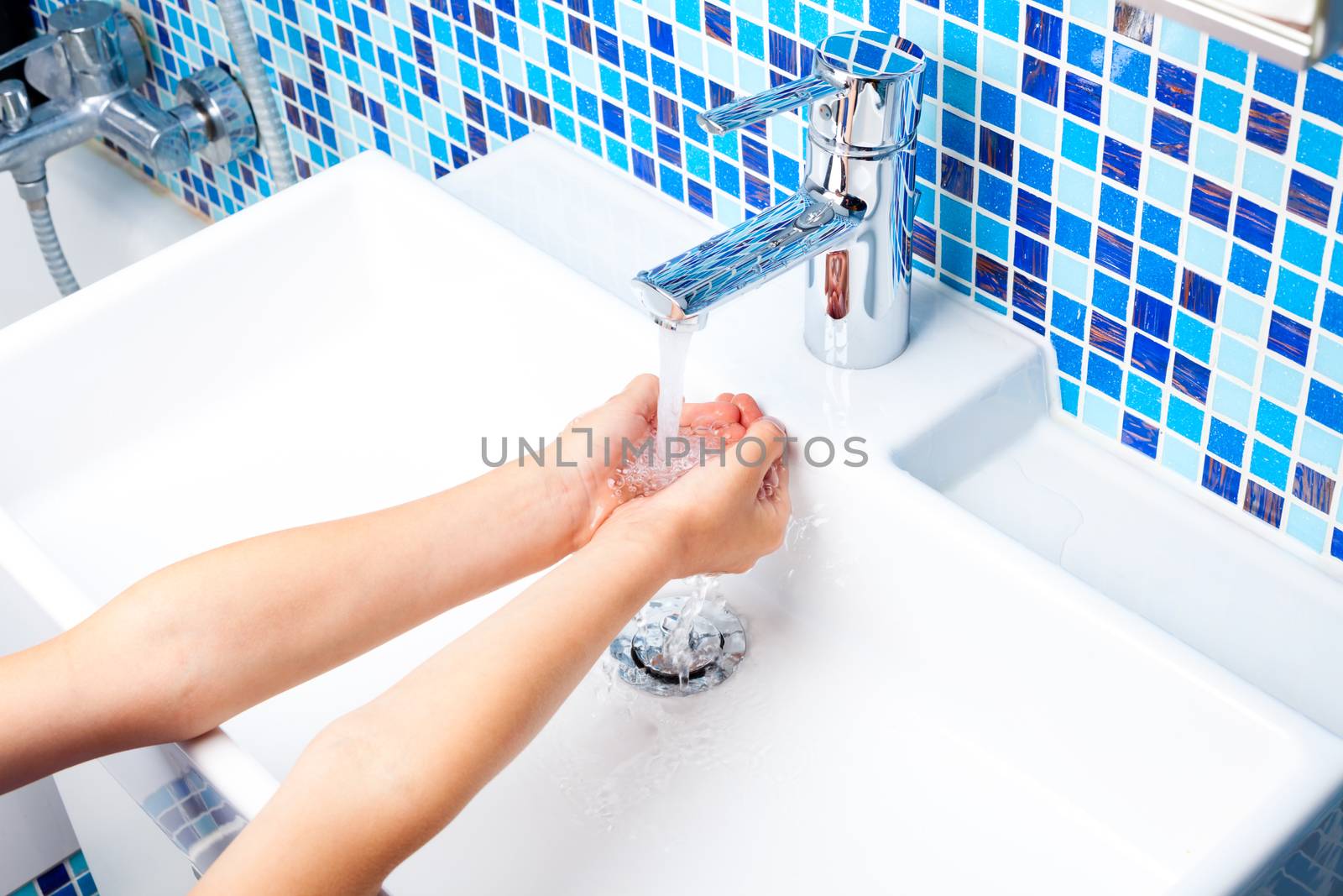Child washing hands by naumoid