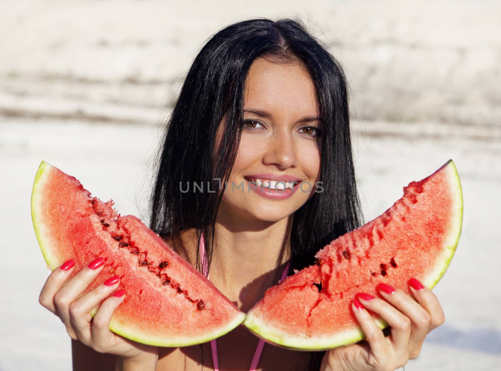 Beautiful girl eats water-melon by ssuaphoto
