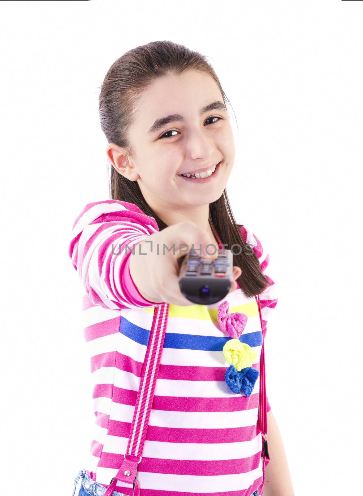 Happy little girl watching tv on white background